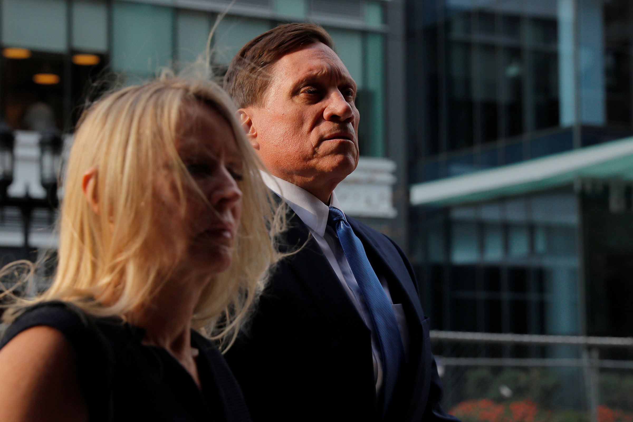 Private equity firm founder John Wilson, charged with participating in a scheme to pay bribes to fraudulently secure the admission of his children to top schools, arrives at federal court for the first day of jury selection in the first trial to result from the U.S. college admissions scandal, which has resulted in dozens of celebrities, executives and coaches facing criminal charges, in Boston, Massachusetts, U.S., September 8, 2021. 