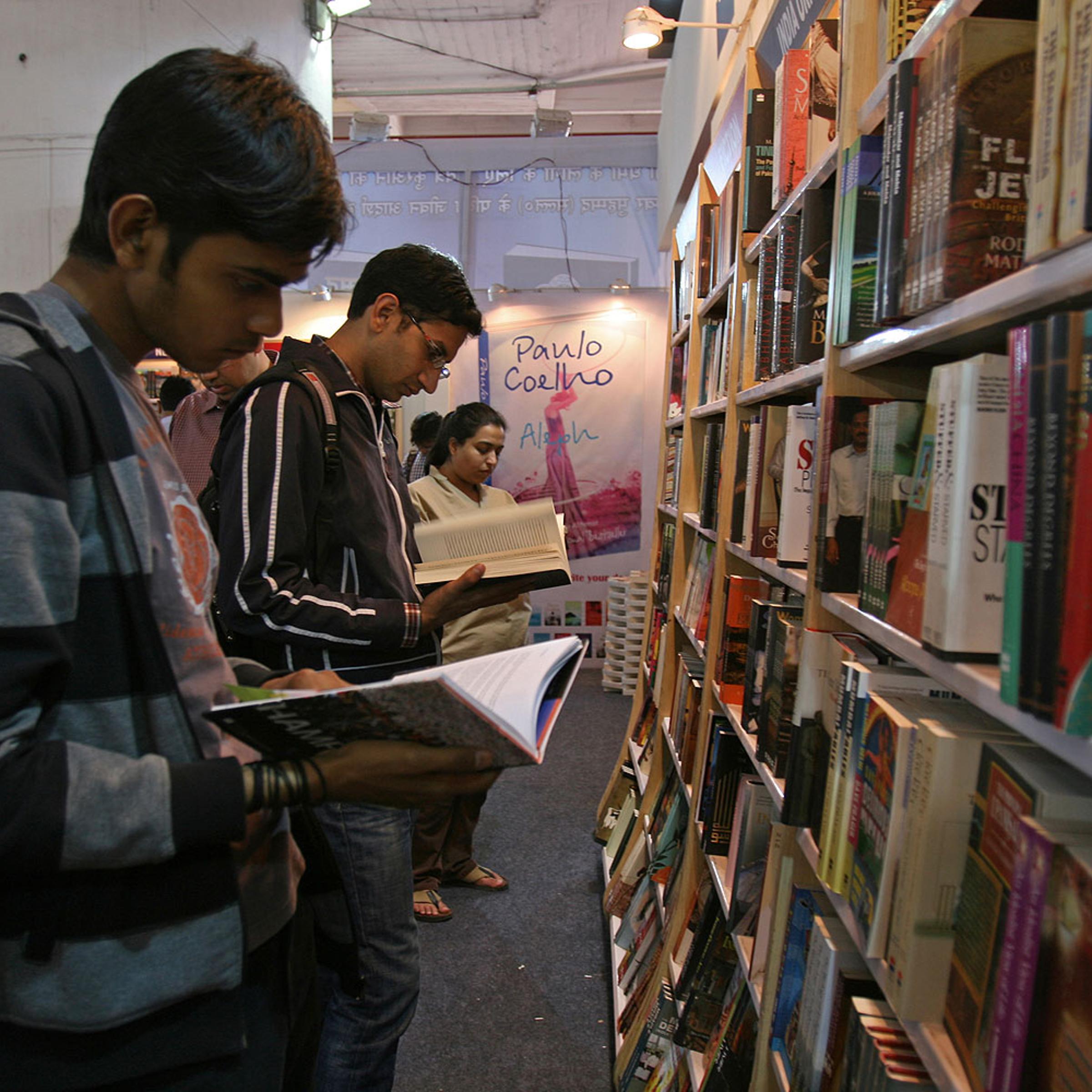 Readers browse through Penguin books in New Delhi. As of today, Wendy Doniger's won't be among them