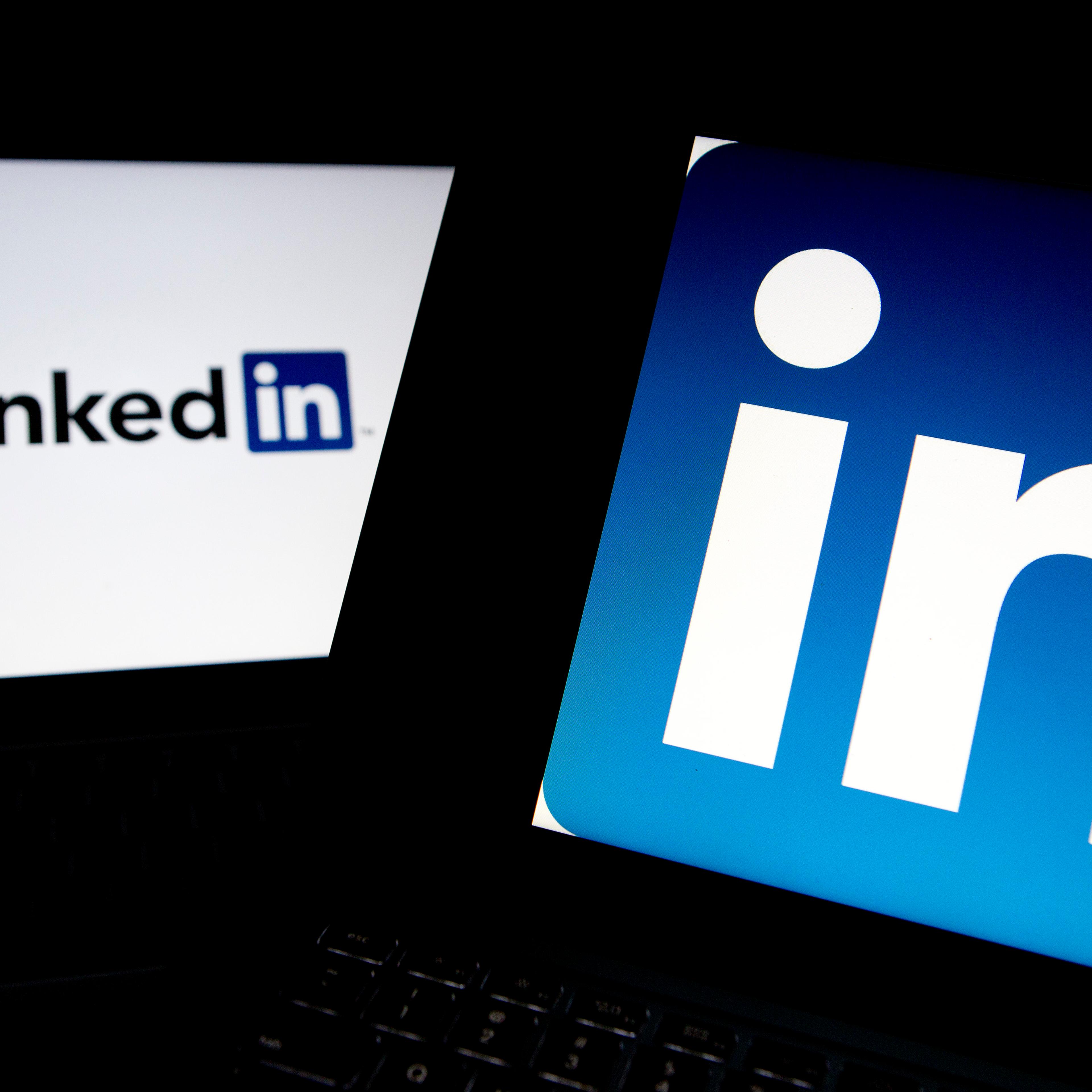 LinkedIn Corp. logos are displayed on laptop computers arranged for a photograph.