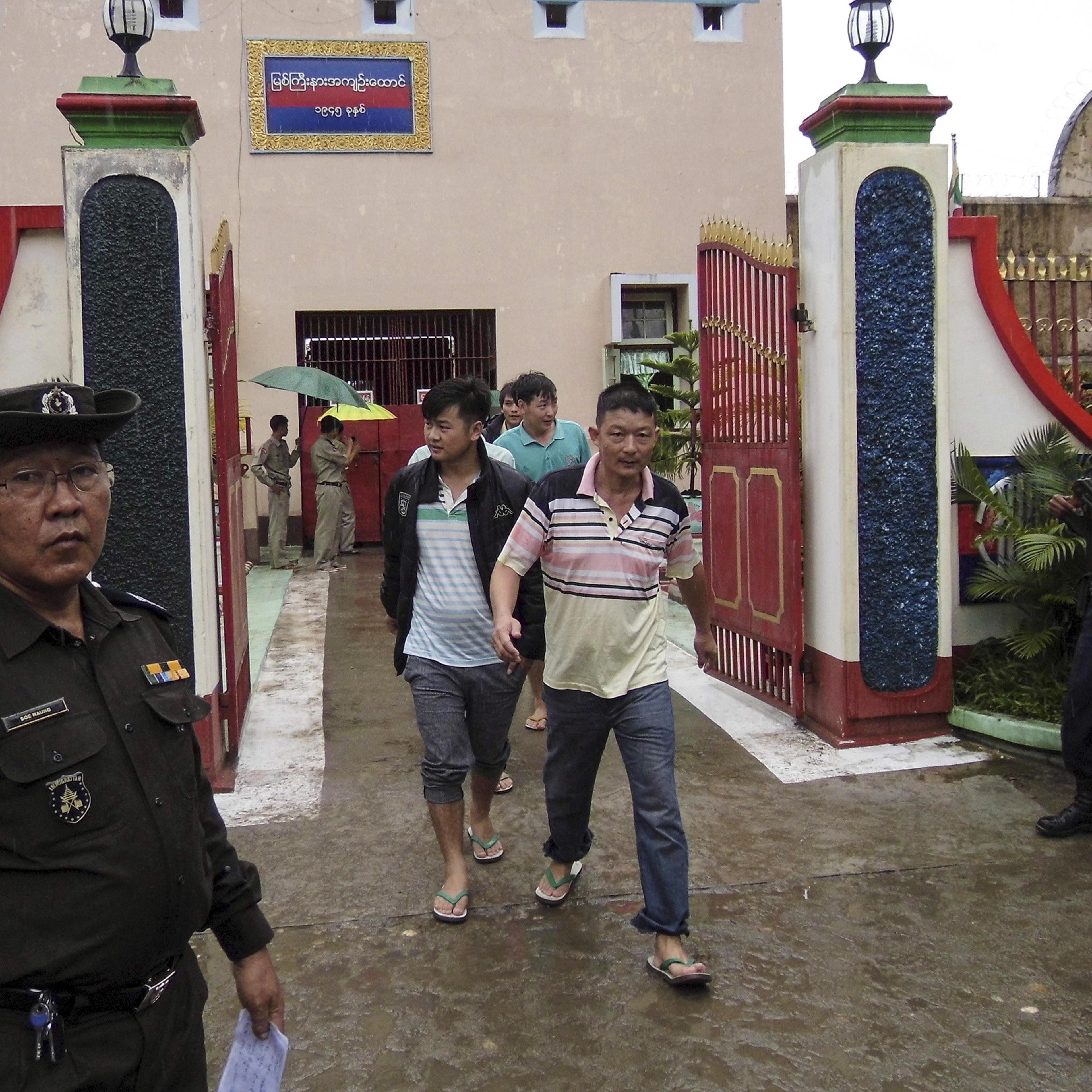 Chinese nationals, who were jailed for illegal logging, walk out of Myitkyina prison after being released during an amnesty in Myitkyina, the capital of Kachin State, north of Burma, July 30, 2015.