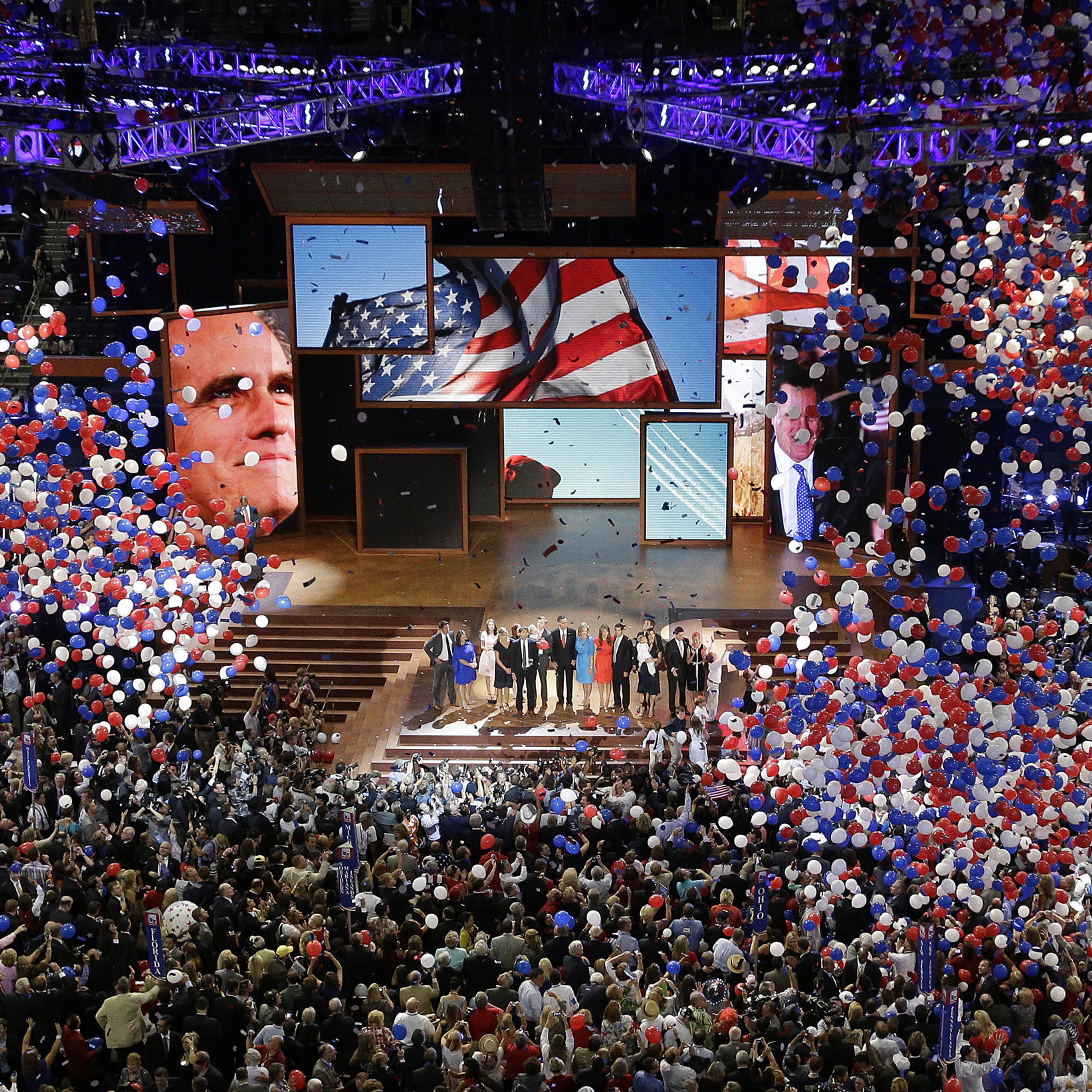 In this Aug. 30, 2012, file photo, Republican presidential nominee Mitt Romney and vice presidential nominee Rep. Paul Ryan are joined on the stage by their families at the end of the Republican National Convention in Tampa, Fla.