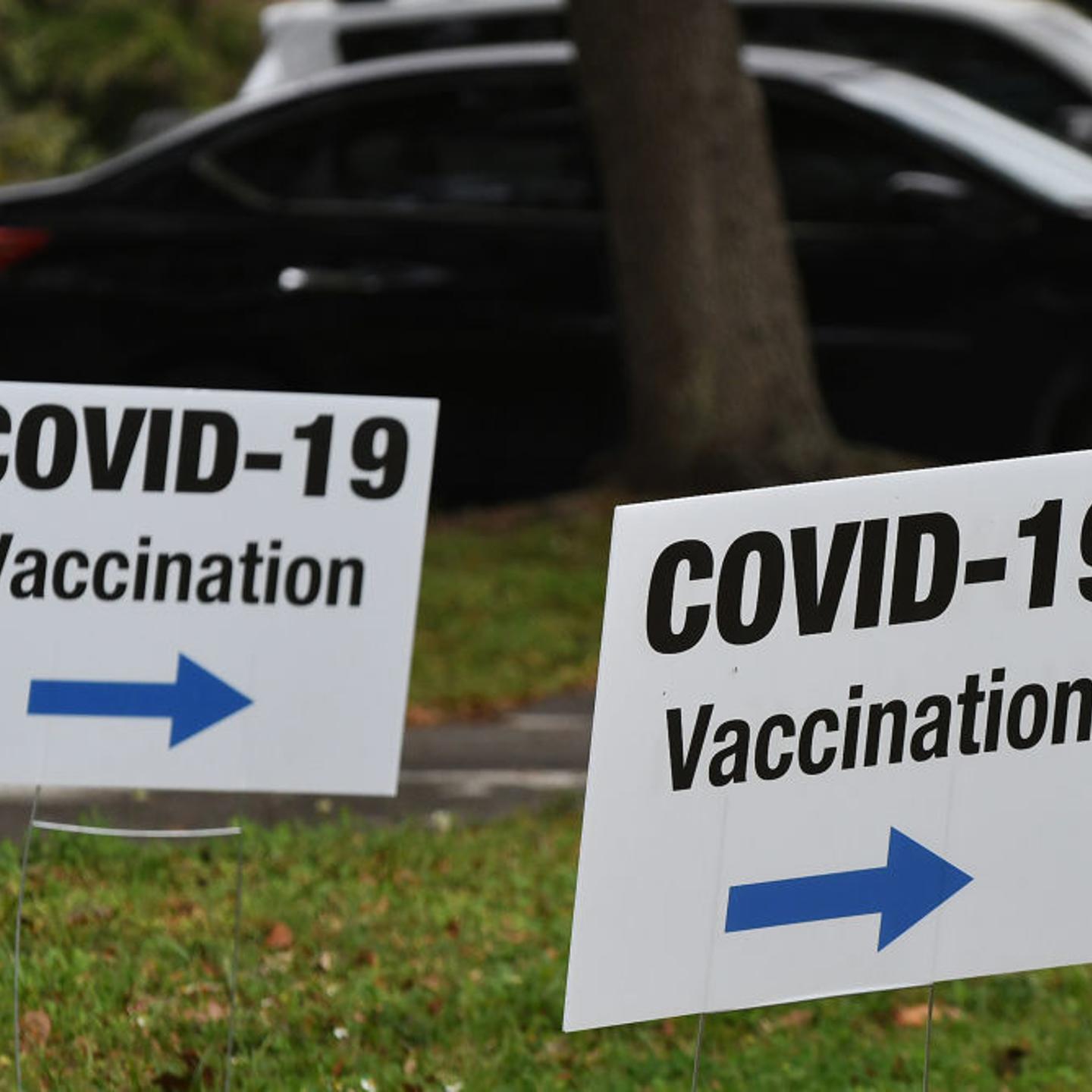 Signs posted at a FEMA COVID-19 vaccination site at the