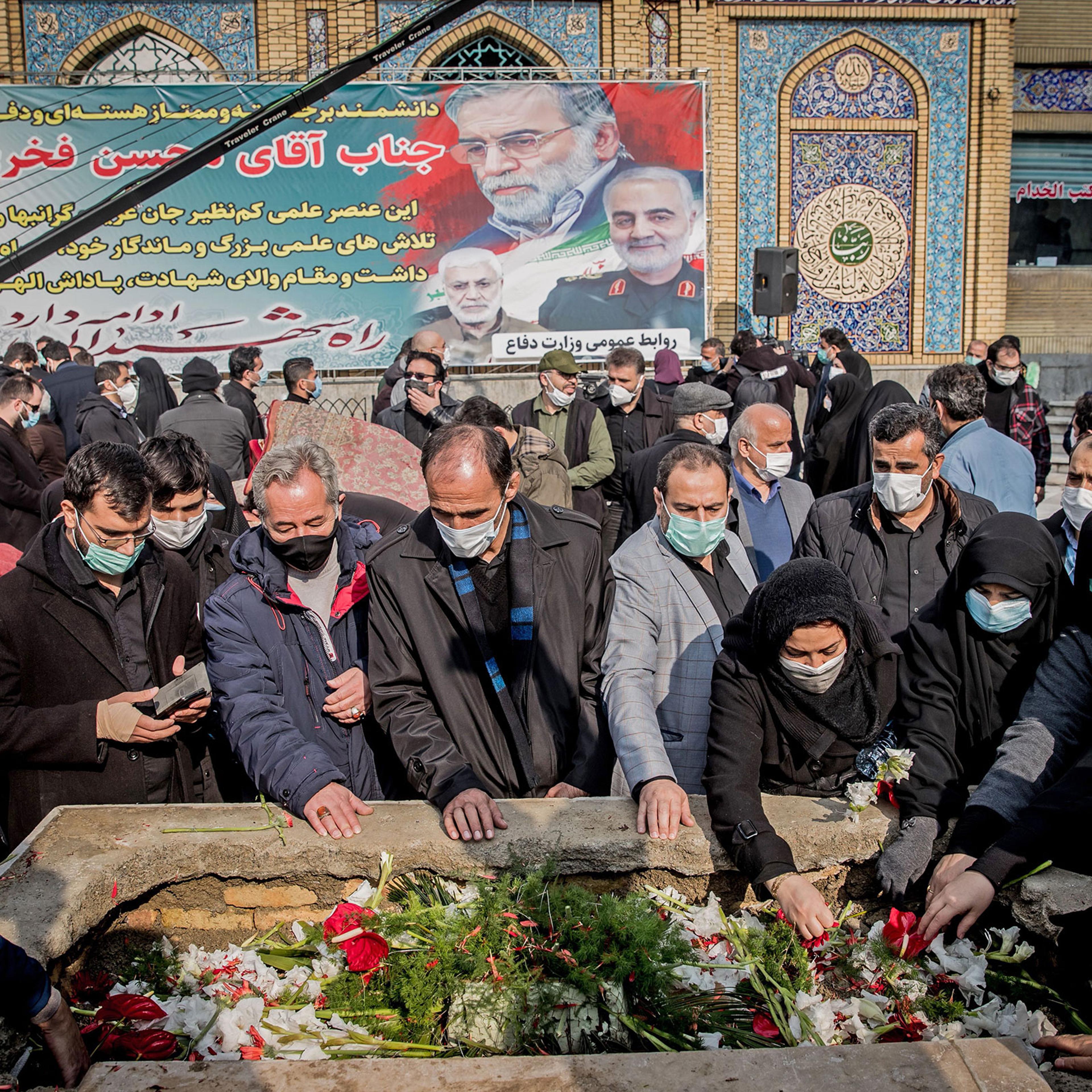 Iranian mourners attend the burial ceremony of slain nuclear scientist Mohsen Fakhrizadeh at Imamzadeh Saleh shrine in northern Tehran, on Nov. 30, 2020.