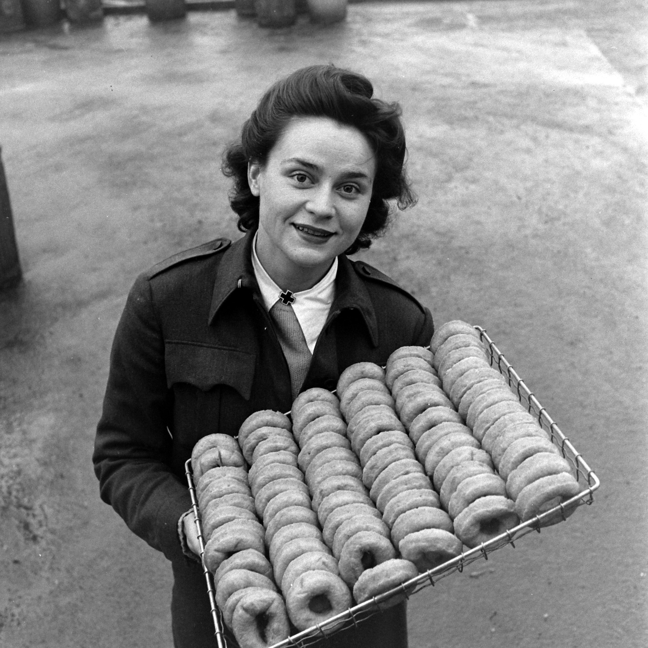 Red Cross Clubmobile Girl Katherine Spaatz serving doughnuts.