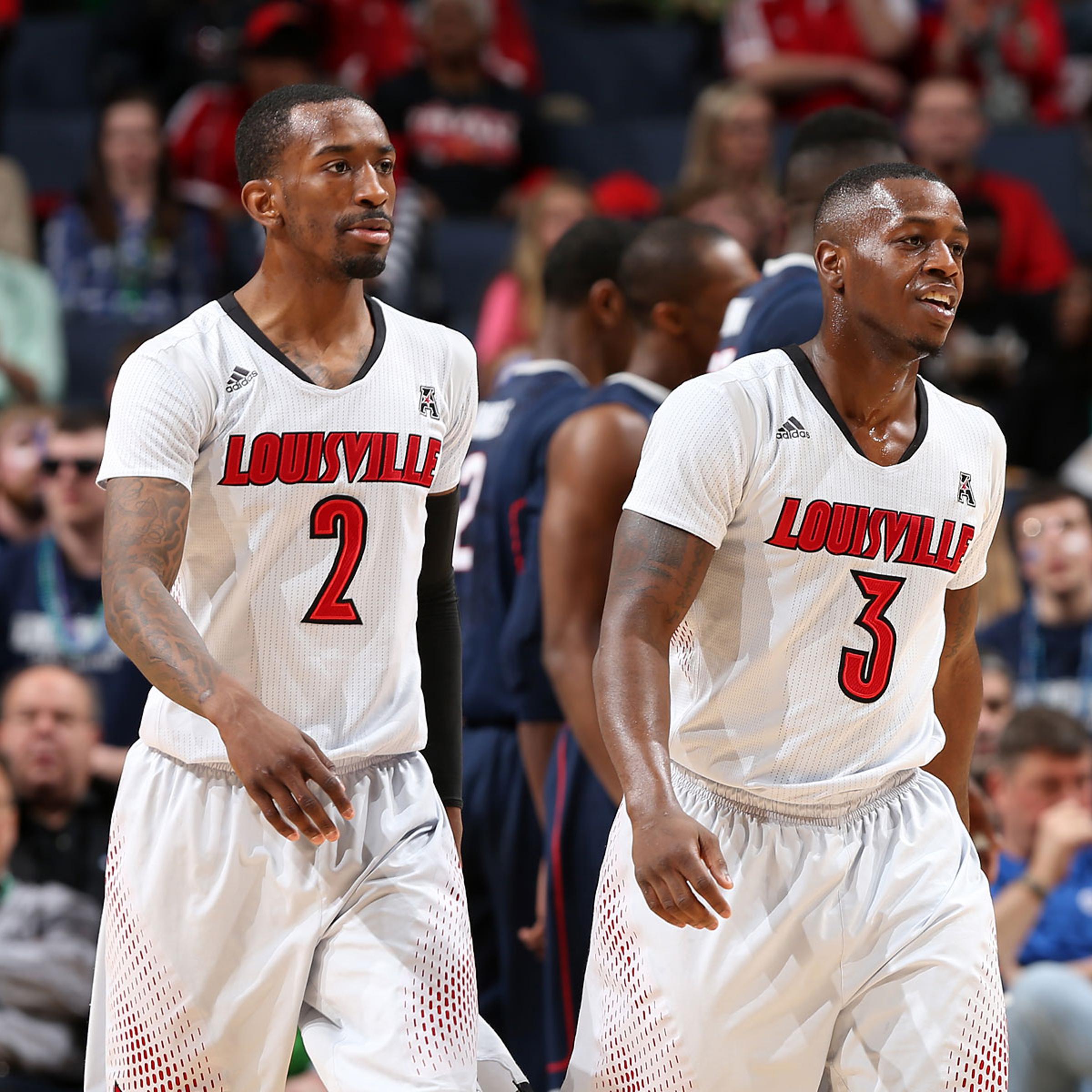From left: Russ Smith #2 and Chris Jones #3 of the Louisville Cardinals during the Championship of the American Athletic Conference Tournament at FedExForum on March 15, 2014 in Memphis.
