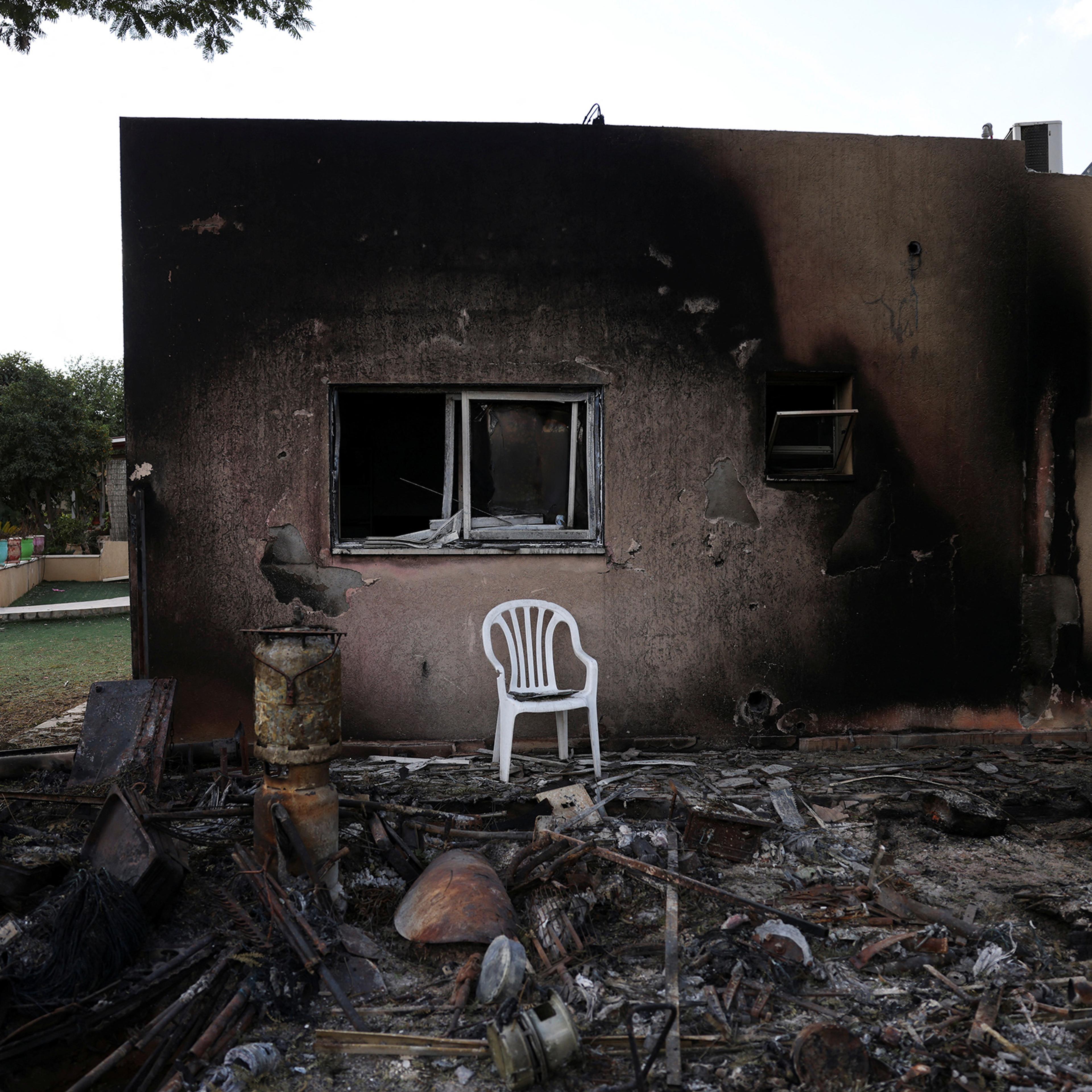 The remains of a burnt house following a deadly infiltration by Hamas gunmen, in Kibbutz Kfar Aza in southern Israel, Oct. 15.