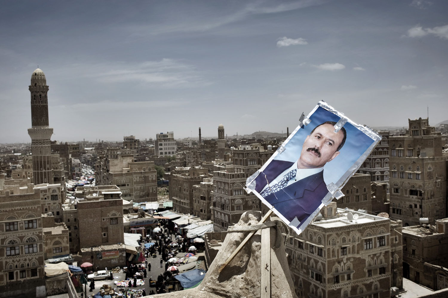 A poster of Yemen's President Ali Abdullah Saleh is seen at the roof of a house at the old town of Sana'a, May 18, 2011.