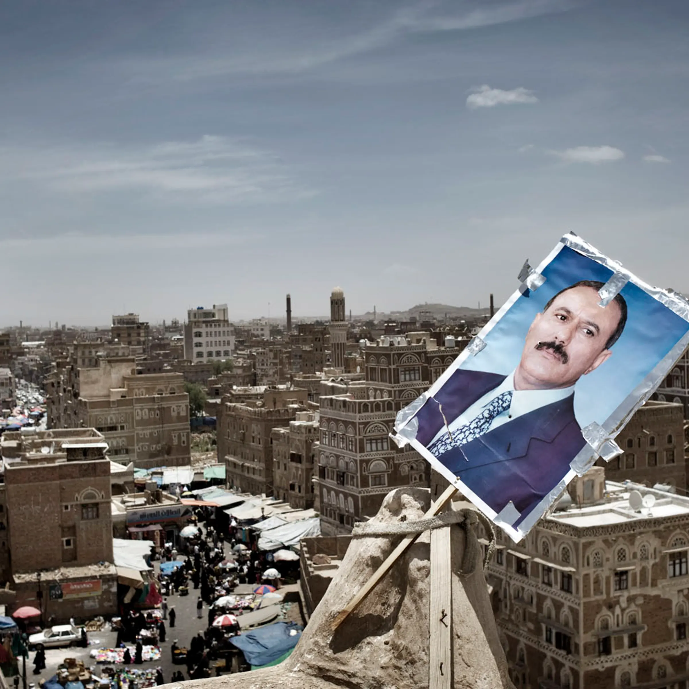 A poster of Yemen's President Ali Abdullah Saleh is seen at the roof of a house at the old town of Sana'a, May 18, 2011.
