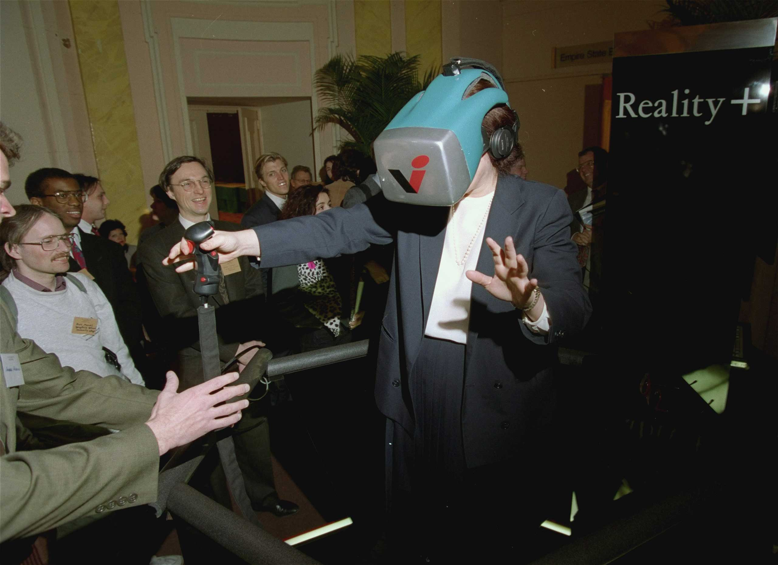 "Reality +" at the Virtual Reality Systems 93 show was described as a next generation, multi-player virtual reality entertainment system that gave a high sense of movement in a computer-generated world revealed in a head-mounted display.