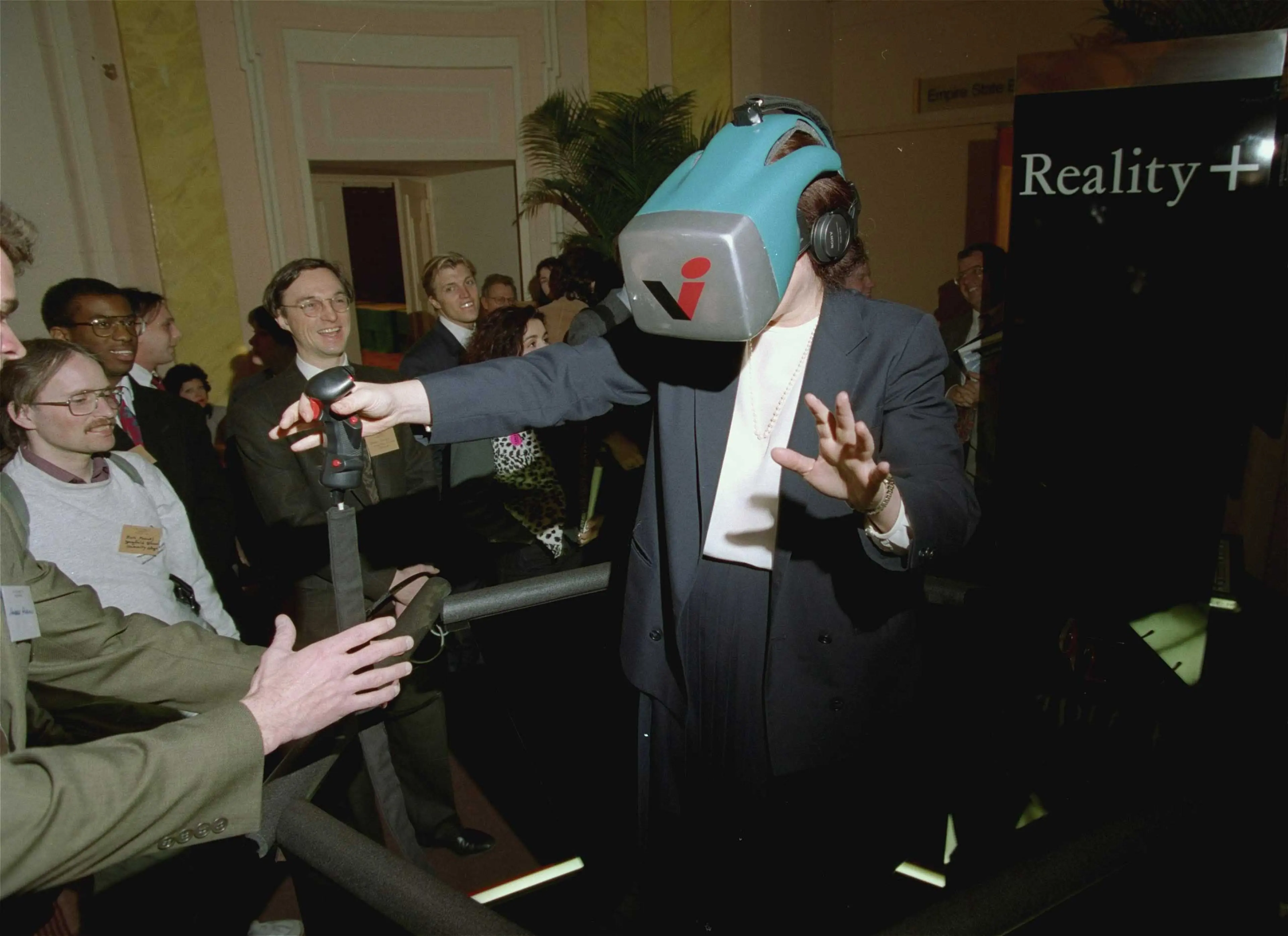 "Reality +" at the Virtual Reality Systems 93 show was described as a next generation, multi-player virtual reality entertainment system that gave a high sense of movement in a computer-generated world revealed in a head-mounted display.
