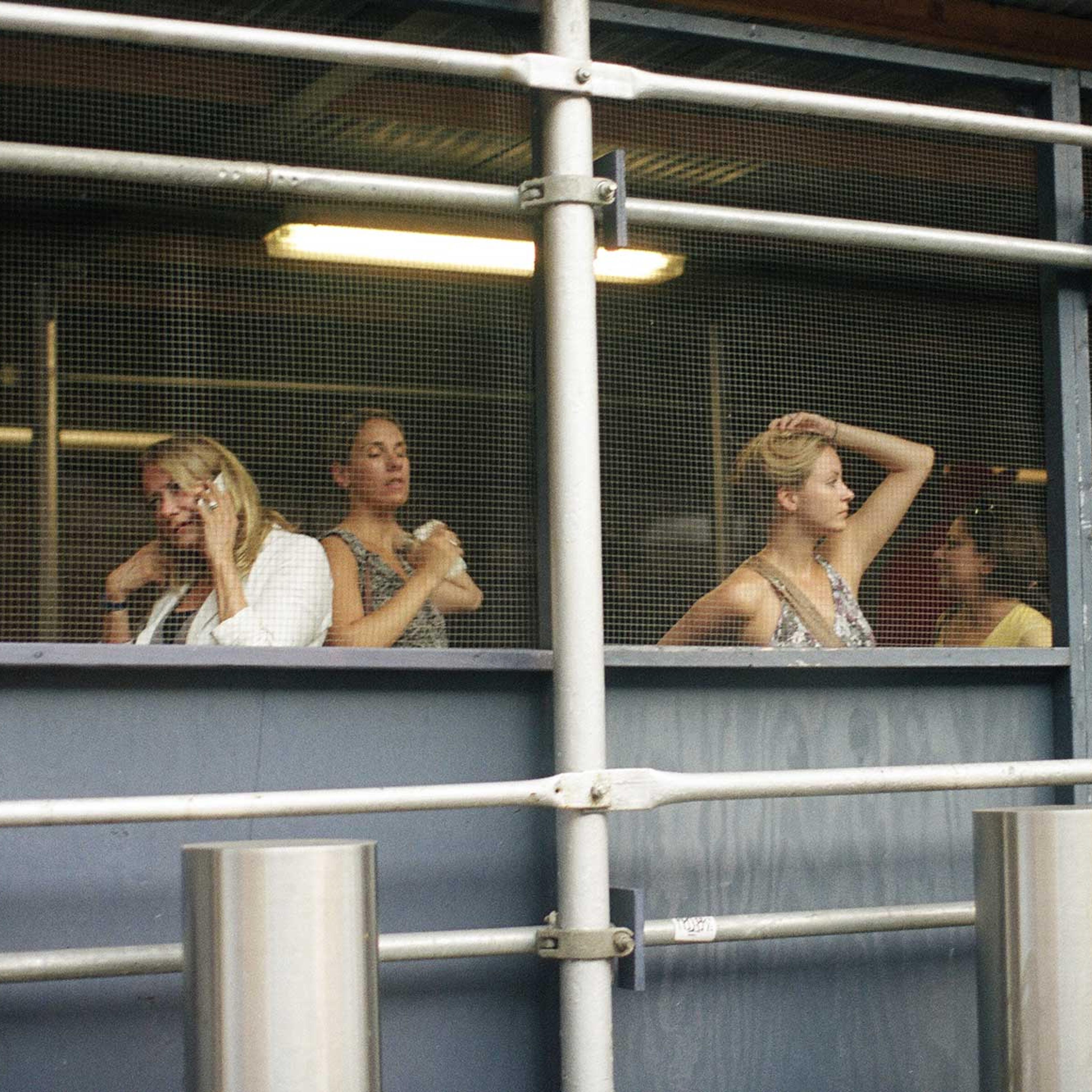 People wait for the bus close to Penn Station in New York City. Two combat vets and two journalists (and a dog) walked along the Amtrak rail lines from Washington, D.C. to Philadelphia to Pittsburgh over the course of a year. Through the heat and summer