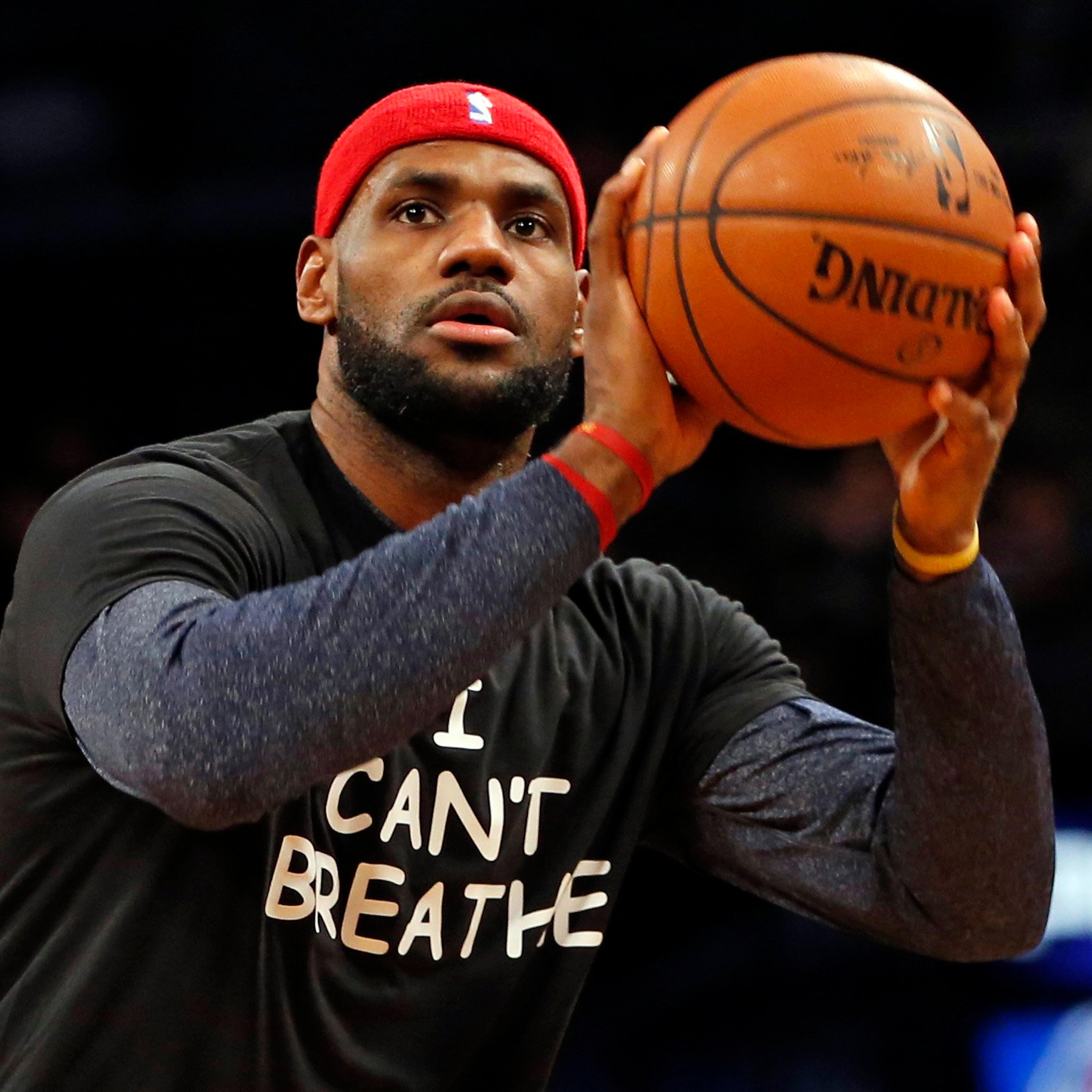 Cleveland Cavaliers forward LeBron James warms up before an NBA basketball game against the Brooklyn Nets at the Barclays Center on Dec. 8, 2014, in New York.