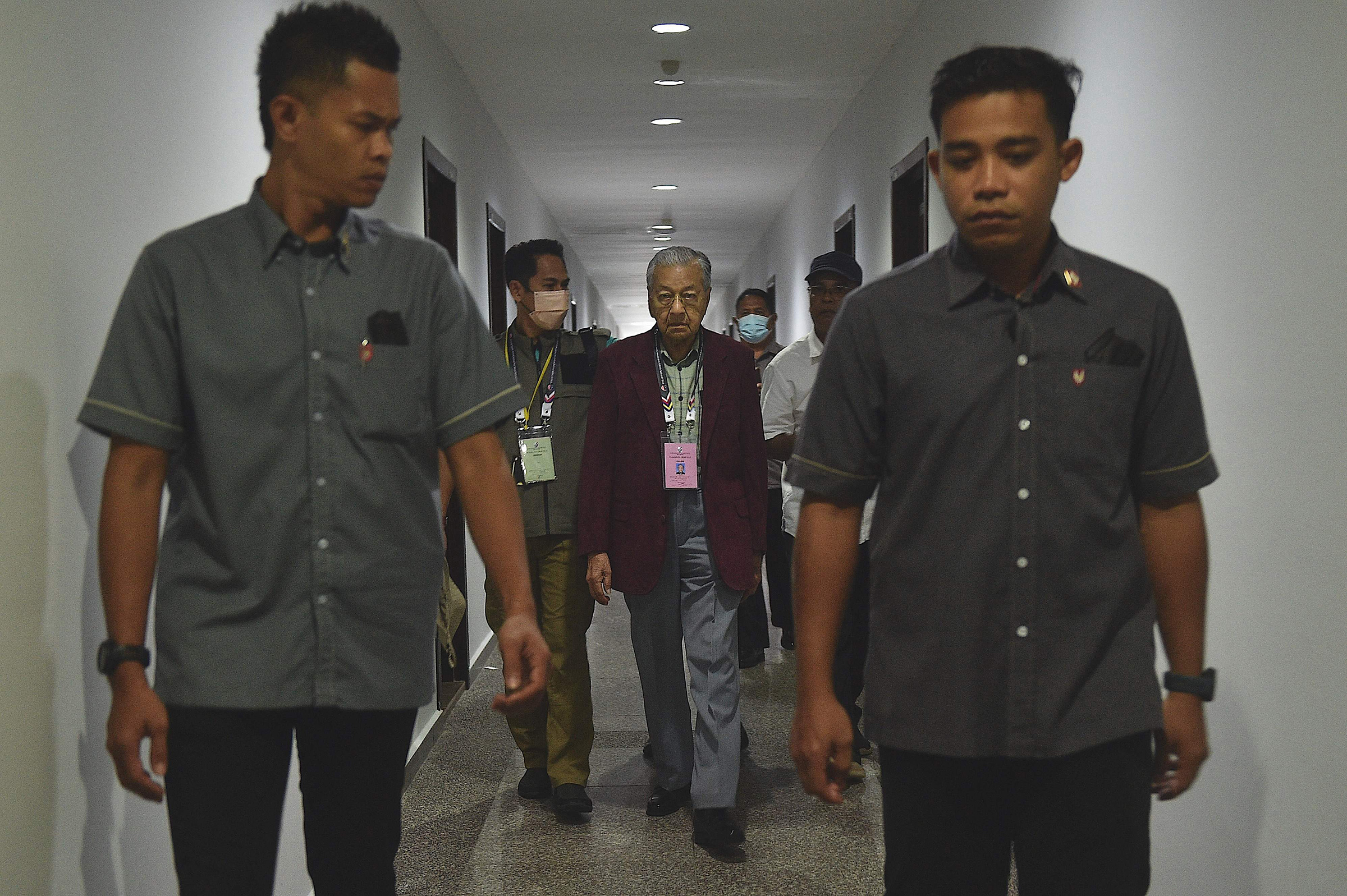 Malaysia's former prime minister Mahathir Mohamad, chairman of Gerakan Tanah Air (Homeland Movement) party, walks toward the nomination center in Langkawi Island on Nov. 5, 2022. 