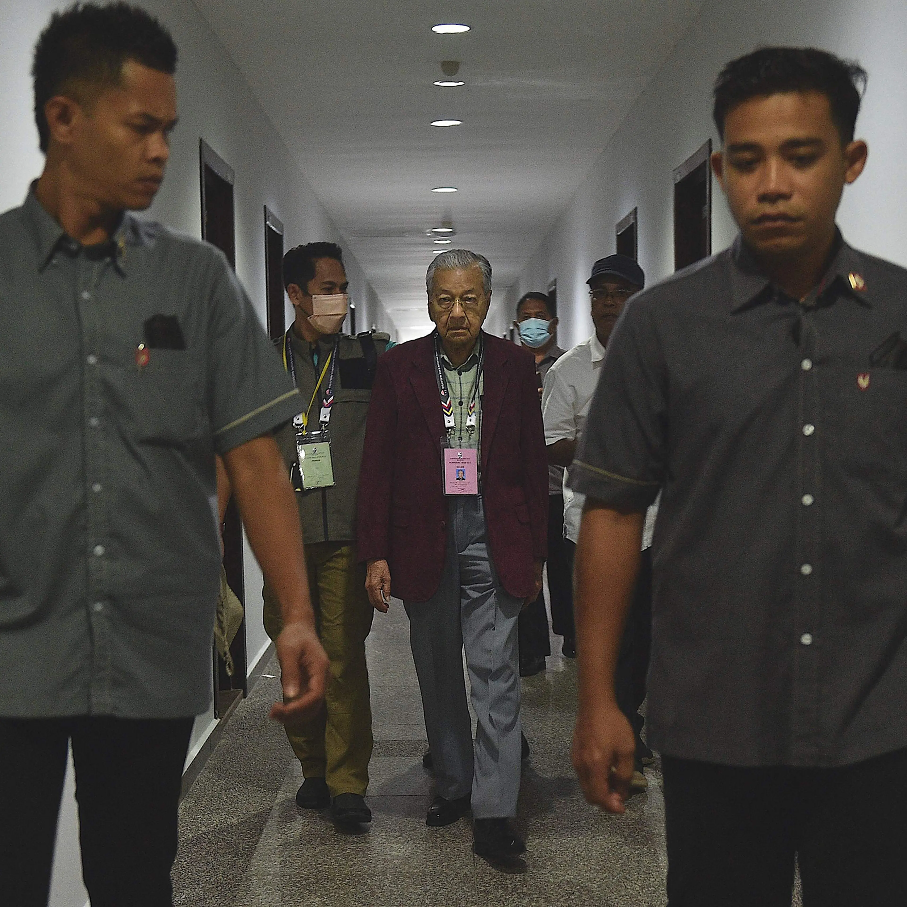 Malaysia's former prime minister Mahathir Mohamad, chairman of Gerakan Tanah Air (Homeland Movement) party, walks toward the nomination center in Langkawi Island on Nov. 5, 2022.