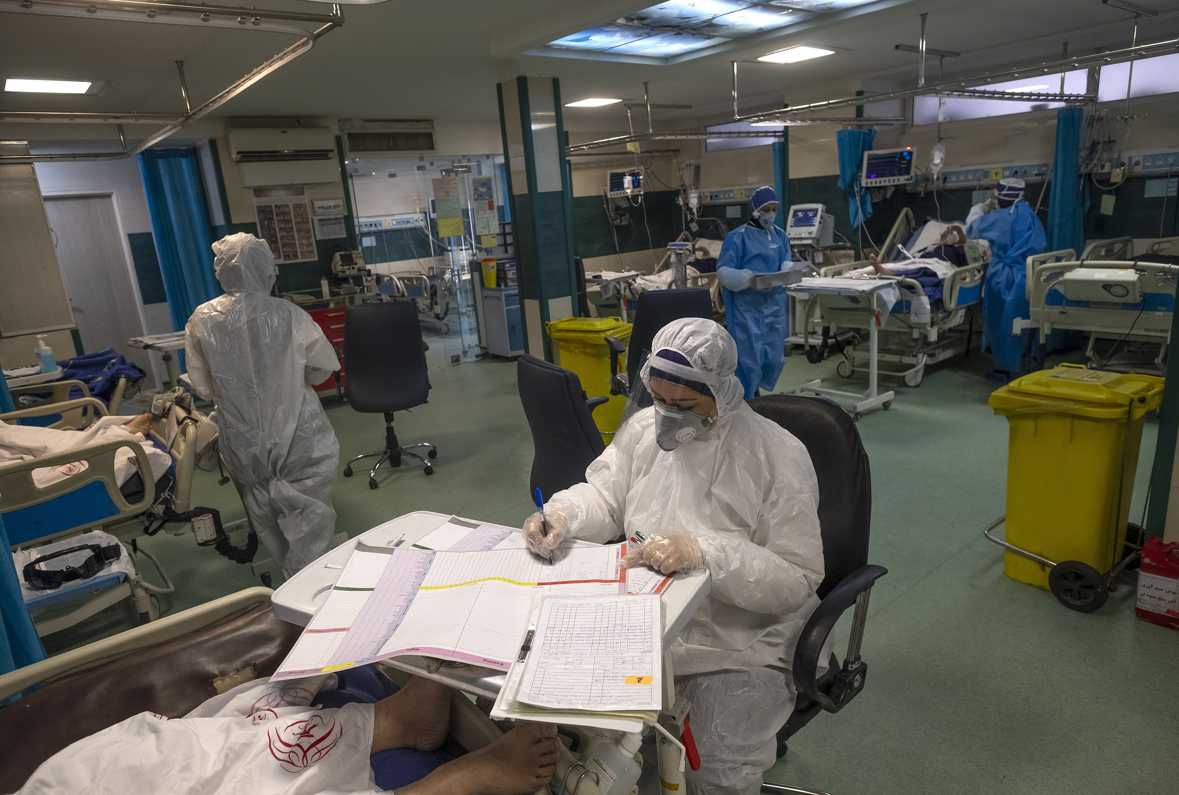 An Iranian medical personnel wearing protective gear works at a quarantine section of the Rassolakram hospital in western Tehran following a new coronavirus outbreak in Iran on March 11.