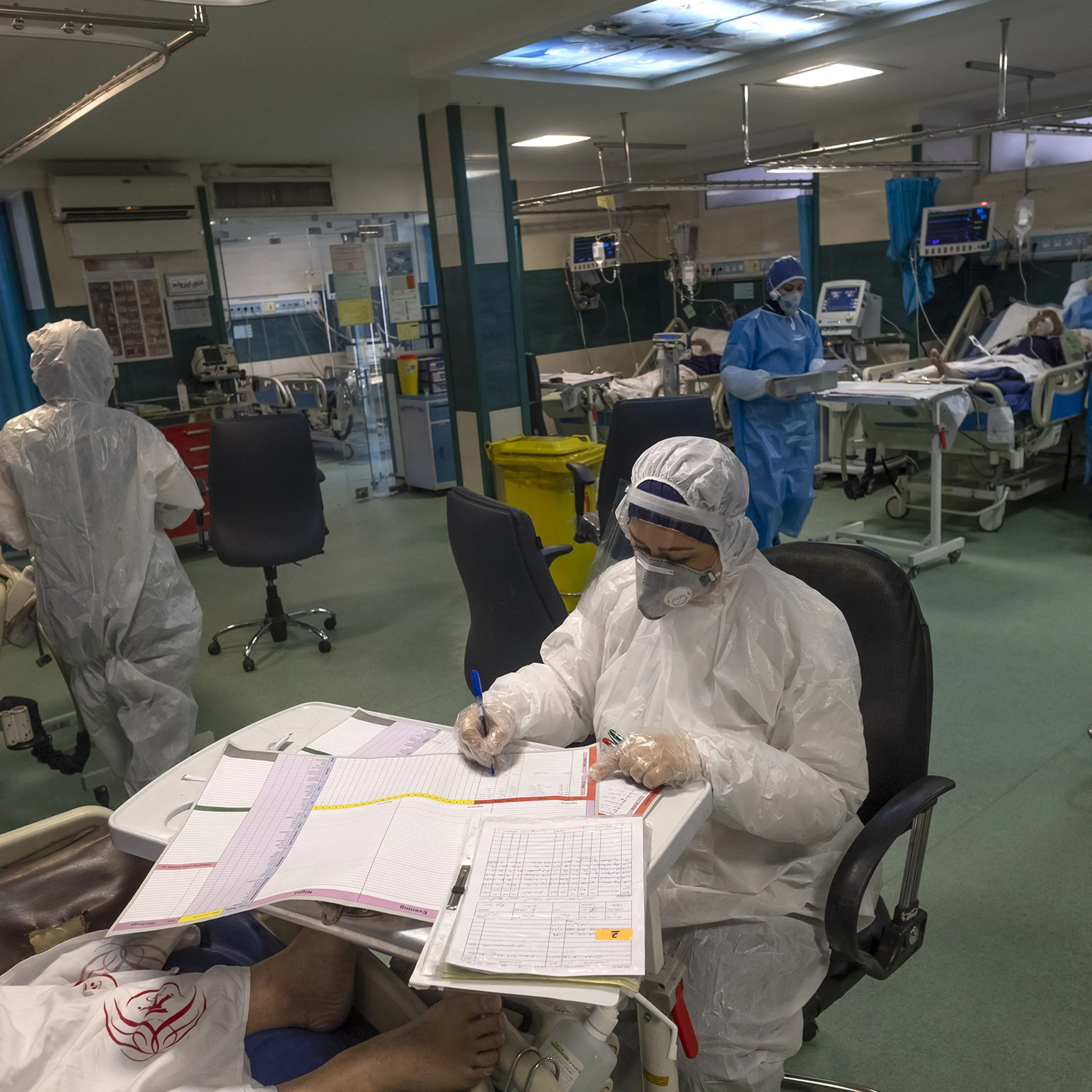 An Iranian medical personnel wearing protective gear works at a quarantine section of the Rassolakram hospital in western Tehran following a new coronavirus outbreak in Iran on March 11.