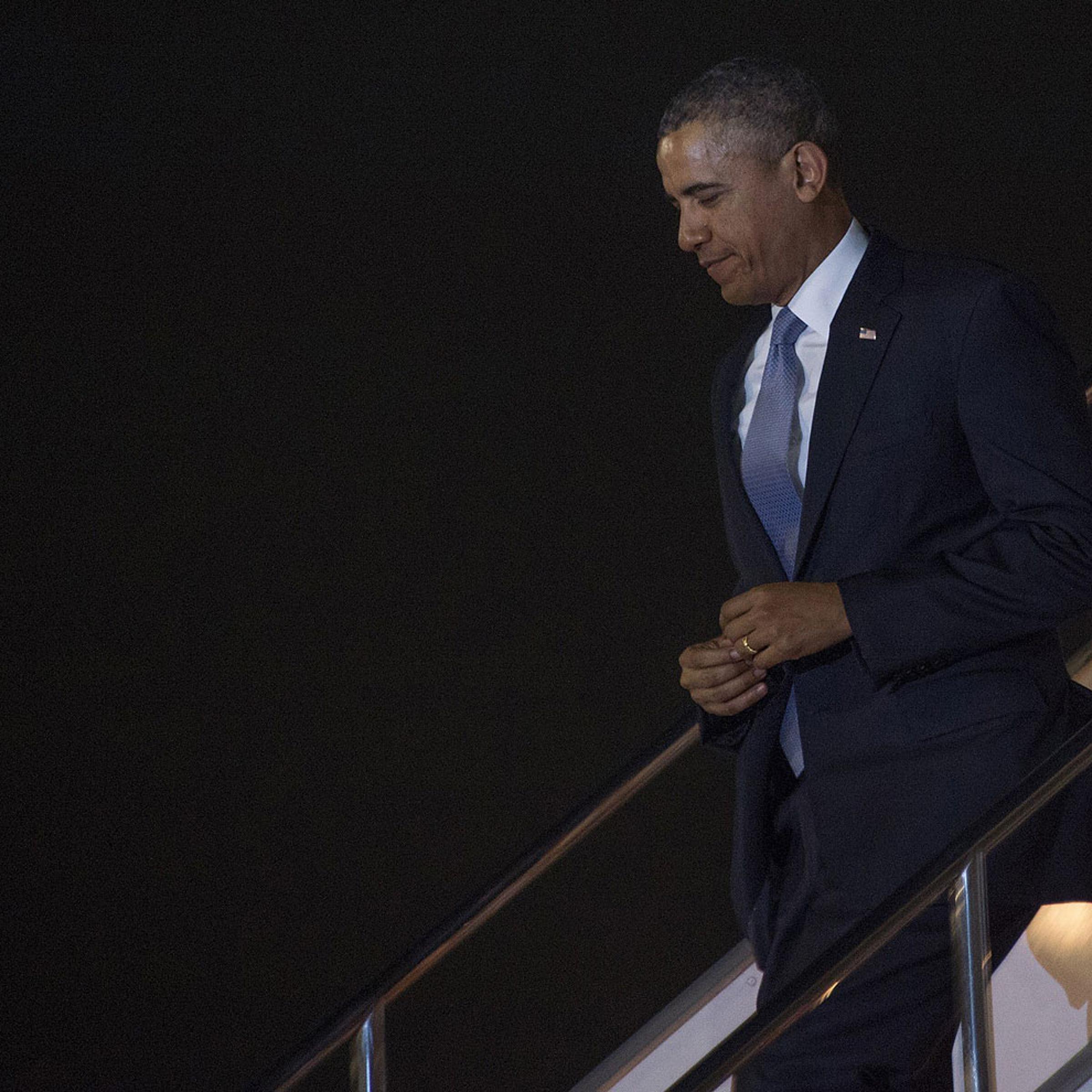President Obama walks off Air Force One as he arrives at Haneda Airport in Tokyo, on April 23, 2014.
