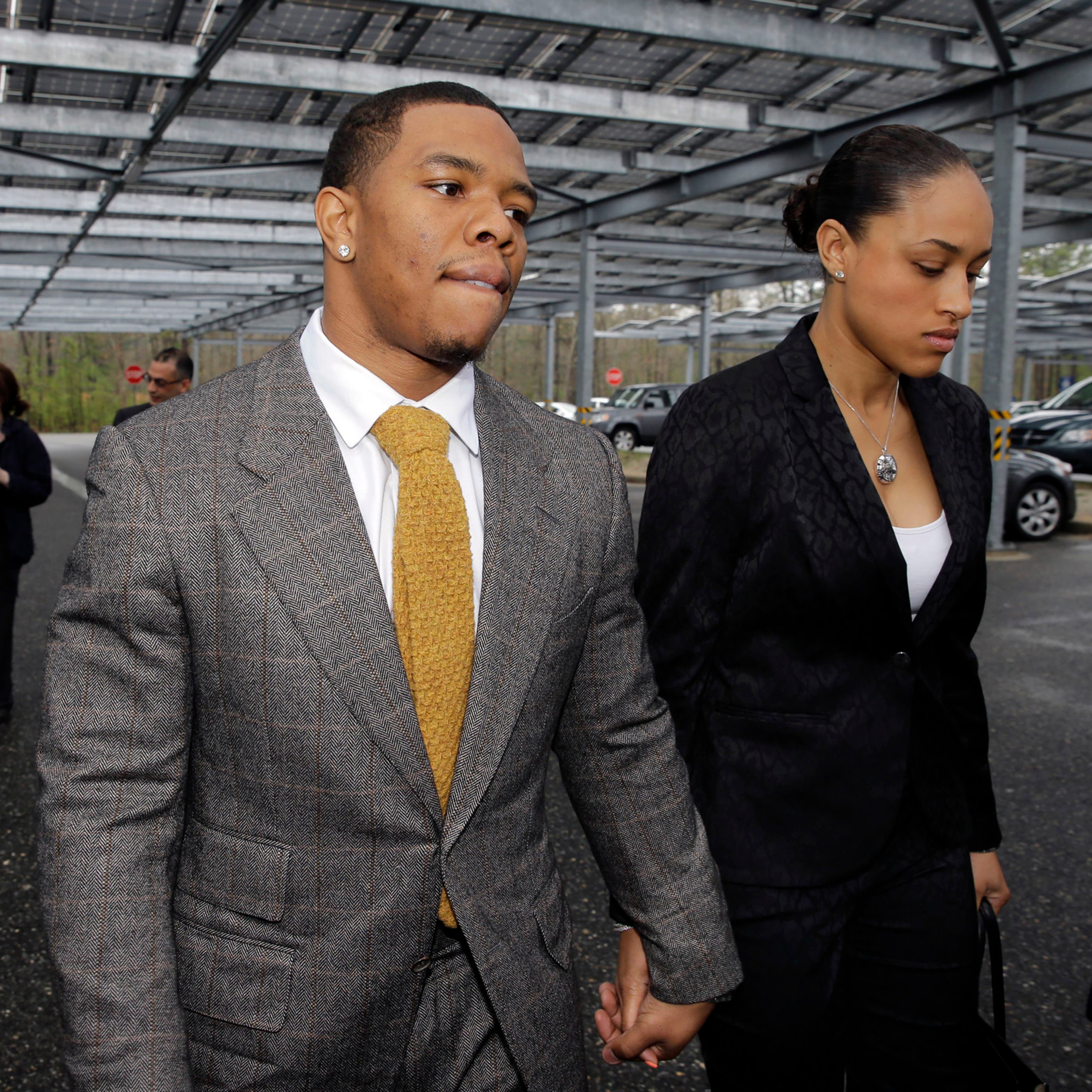 Baltimore Ravens football player Ray Rice holds hands with his wife, Janay Palmer, as they arrive at Atlantic County Criminal Courthouse in Mays Landing, N.J., in May 2014.