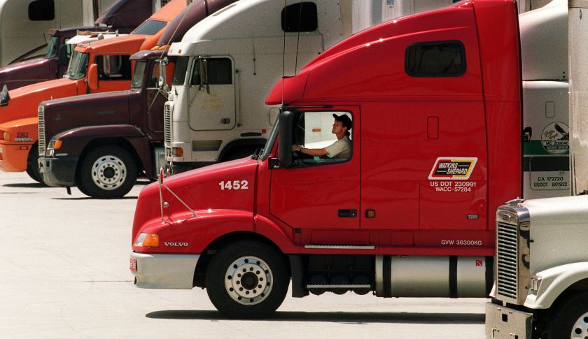 007279.ME.0427.trucks.2.LS. Trucker backs his rig into bays at Ralphs Supermarkets distribution cent