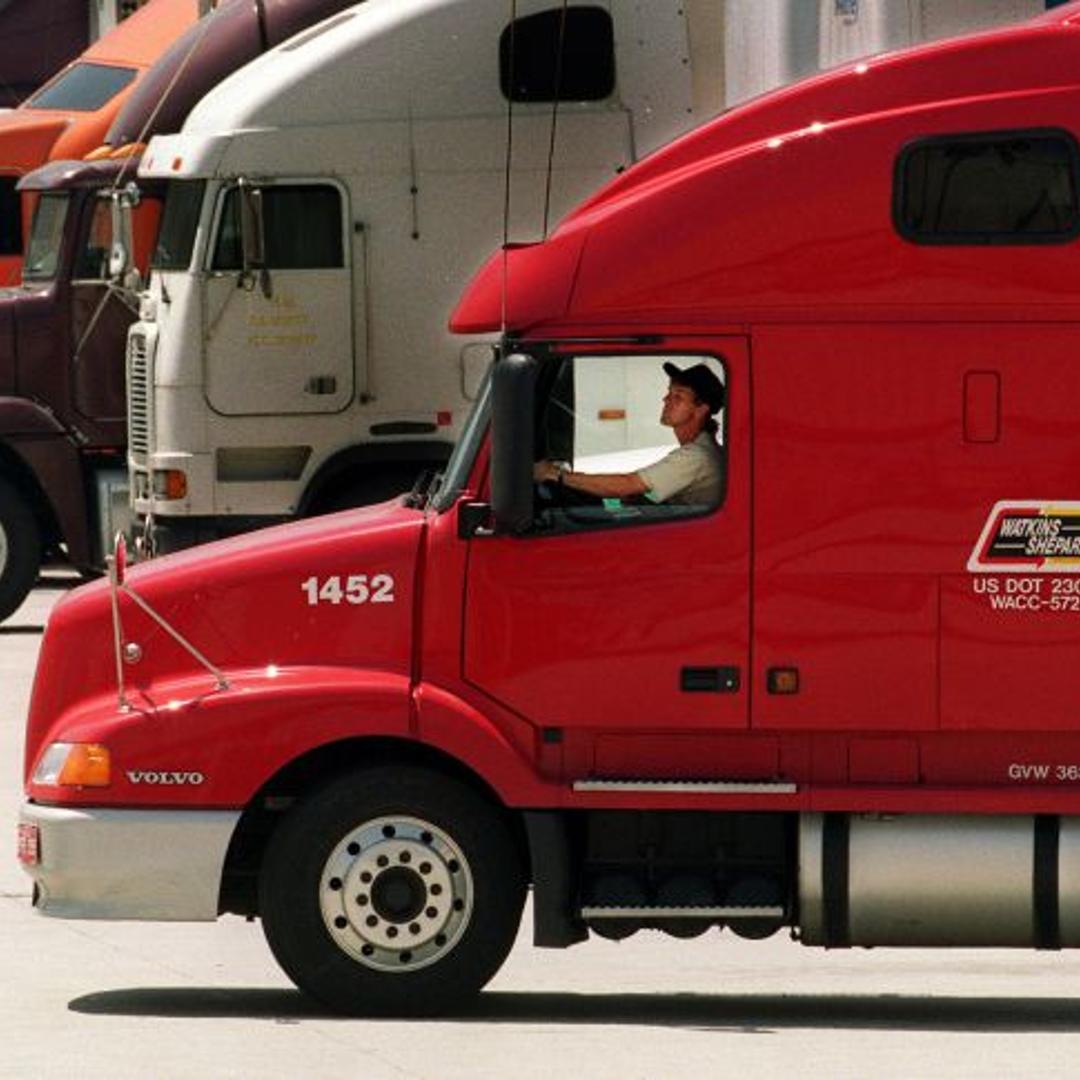 007279.ME.0427.trucks.2.LS. Trucker backs his rig into bays at Ralphs Supermarkets distribution cent