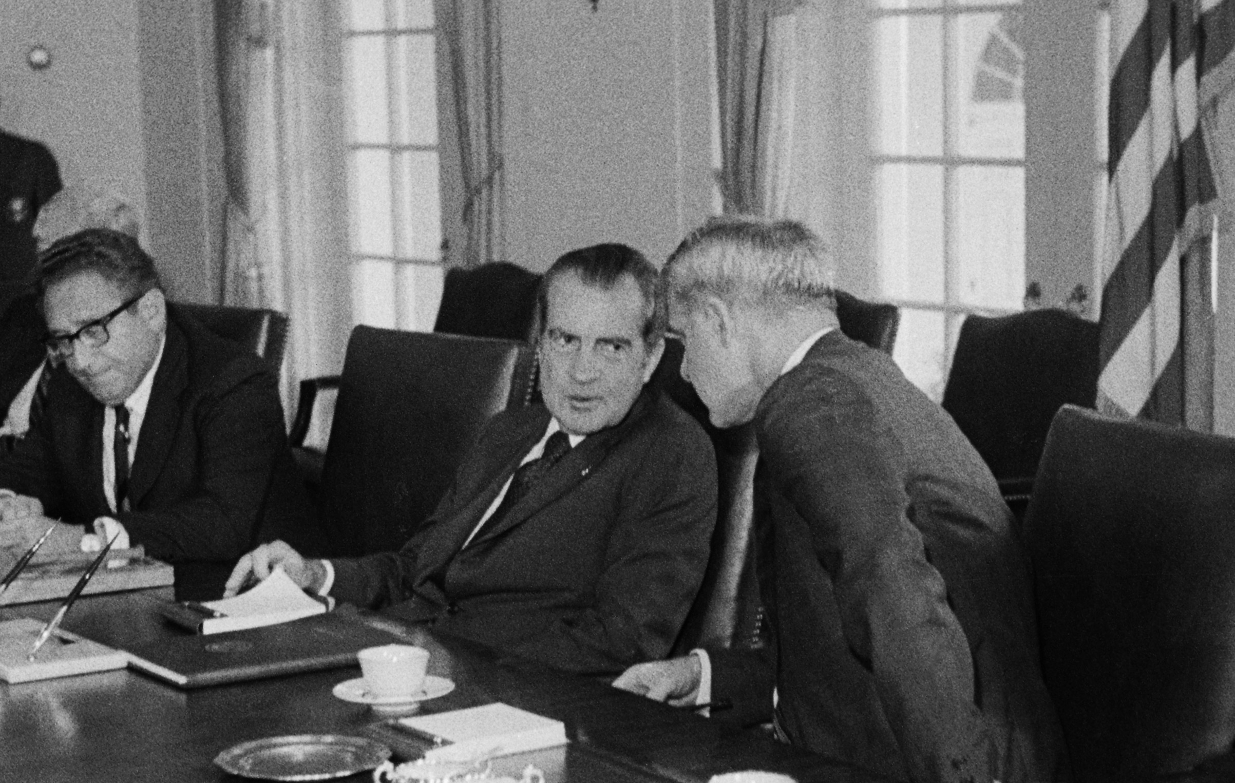 Nixon flanked by Secretary of State Henry Kissinger (left) and Secretary of Defense James Schlesinger at the White House on Aug. 6, 1974.