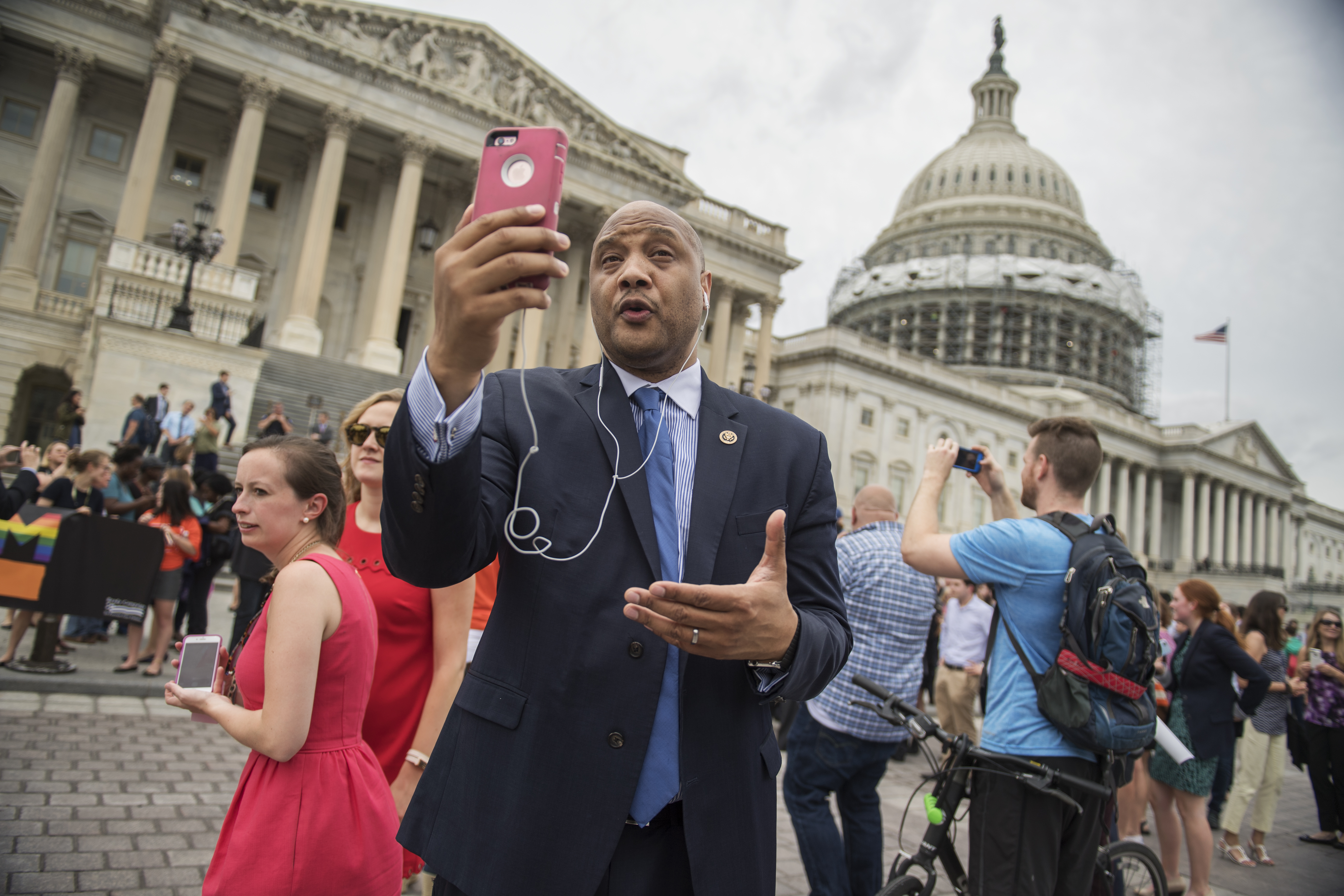 Rep. Andre Carson, D-Ind., concurs an interview via FaceTime on the East Front of the Capitol after the House Democrats' sit-in ended on the floor, June 23, 2016.