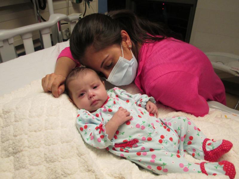 Alysia Padilla-Vacarro and daughter Evangelina on the day of her gene therapy treatment. Evangelina, now two years old, has had her immune system restored and lives a healthy and normal life.