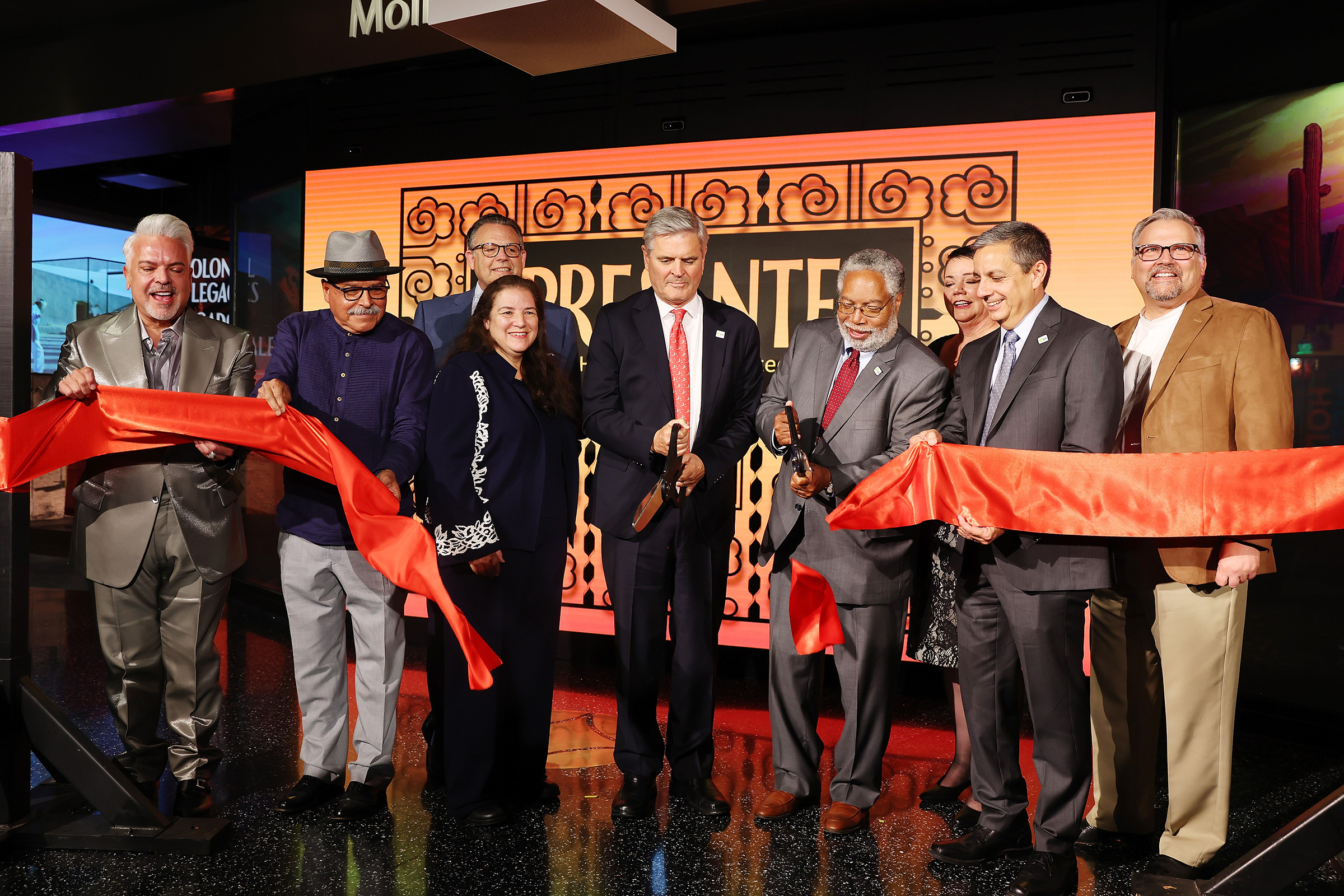 From left: Henry R. Muñoz III, Eduardo Díaz, J. Mario Molina, Martha Molina Bernadett, Steve Case, Lonnie Bunch, III, Josephine Molina, Jorge Zamanillo and John C. Molina cut the opening ribbon during the '¡Presente! A Latino History of the United States