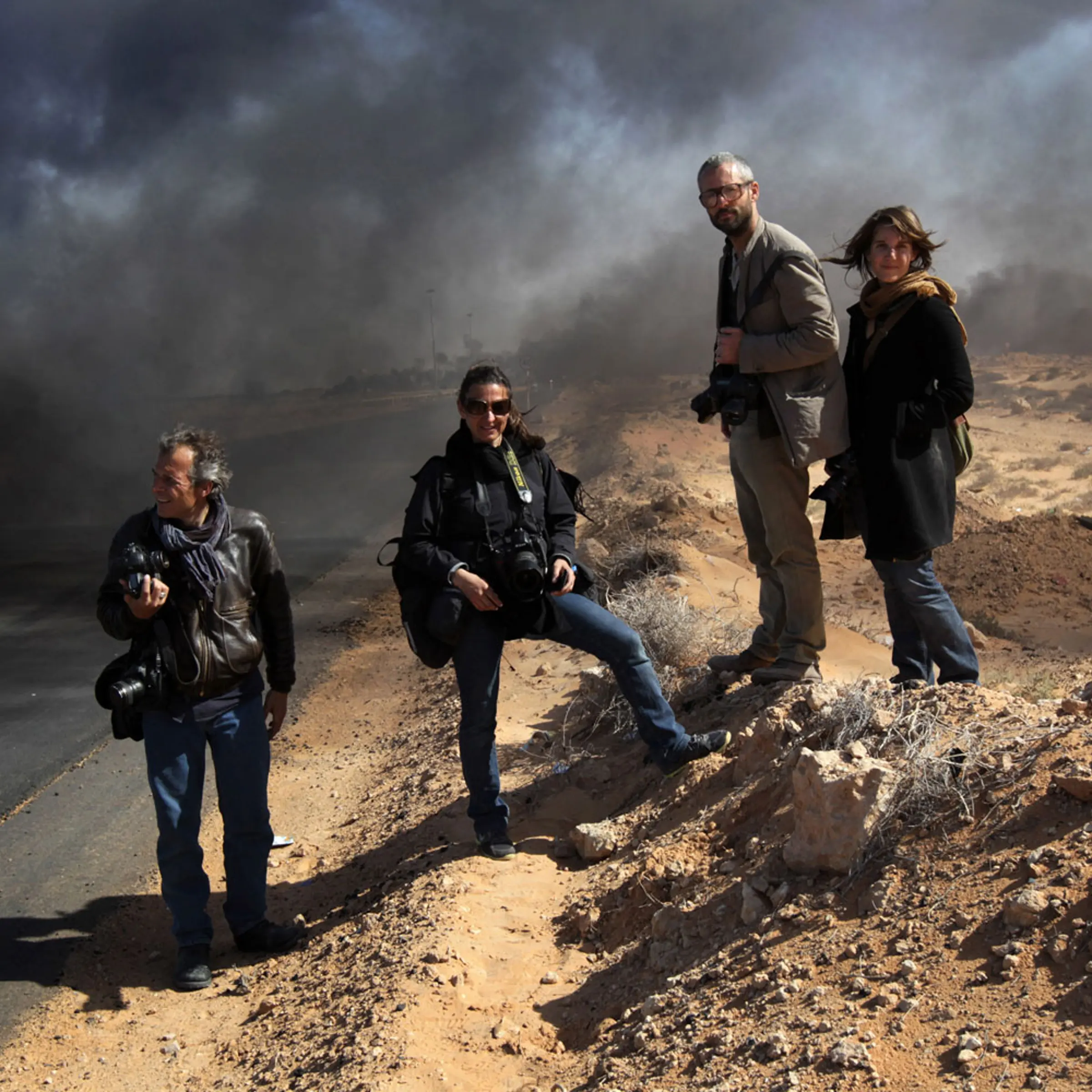 Yuri Kozyrev, Lynsey Addario, Tyler Hicks and Nicki Sobecki in Ras Lanuf, Libya, March 11, 2011.