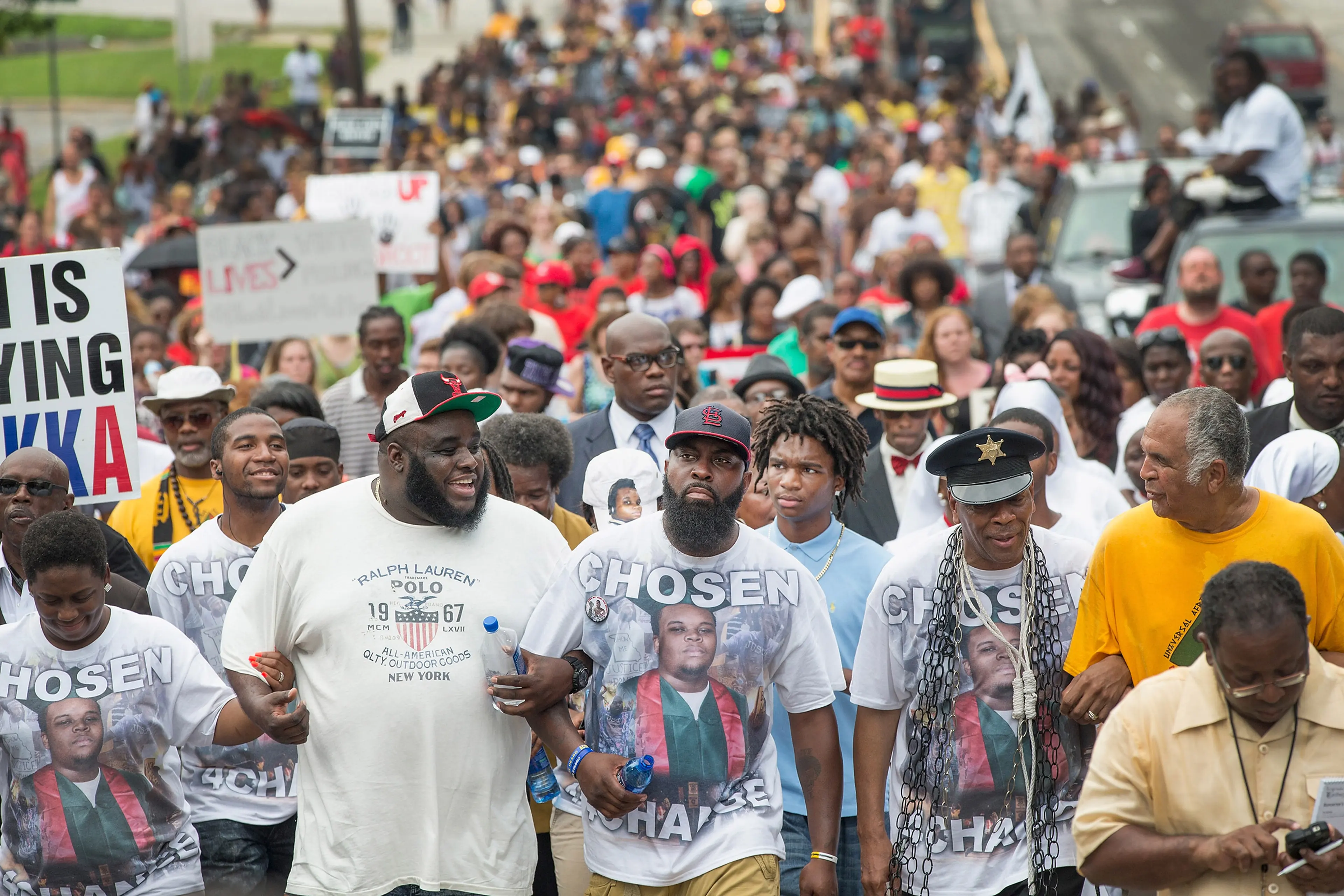 Michael Brown Sr. leads a march from the location where his son Michael Brown Jr. was shot and killed