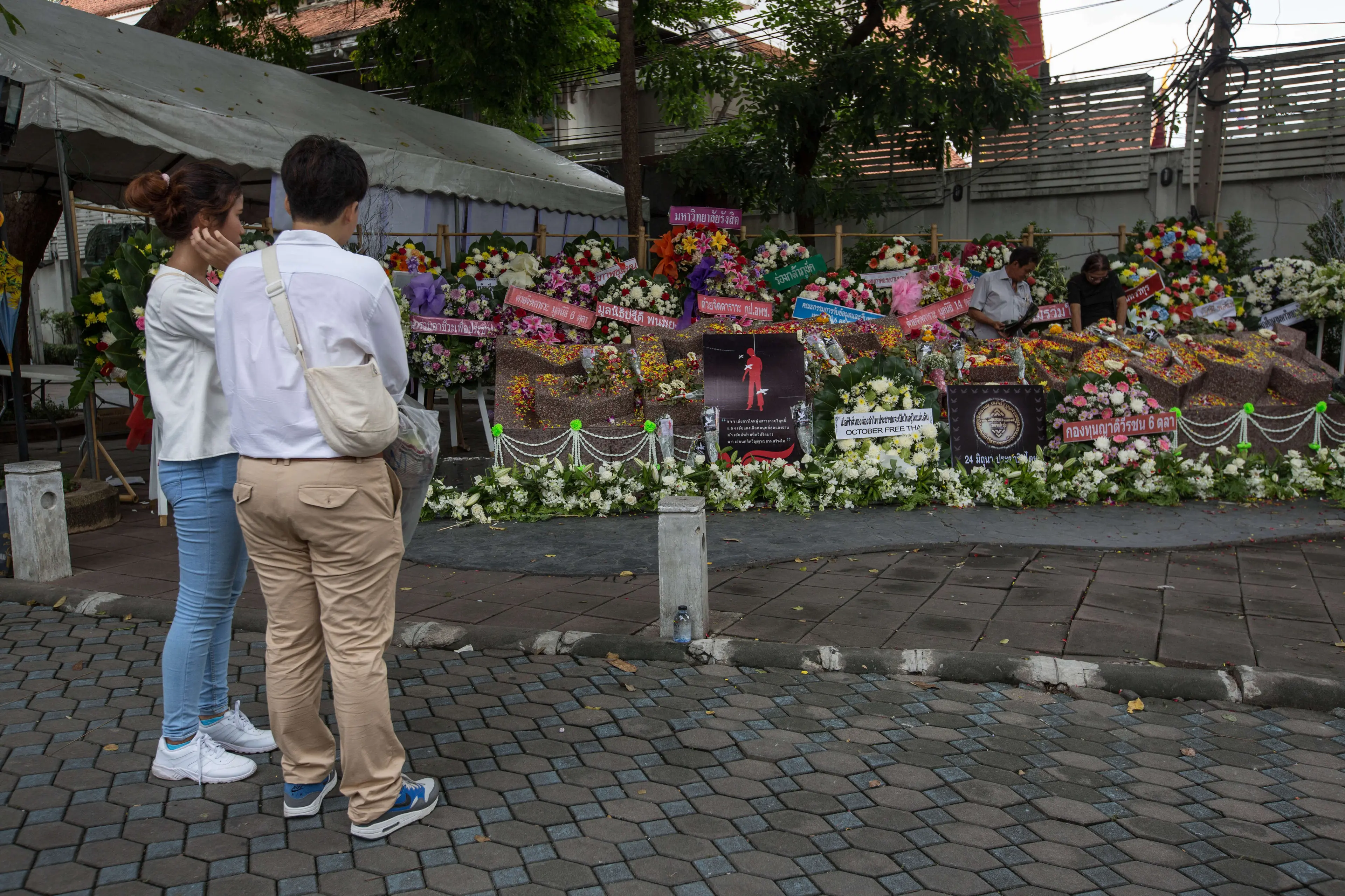 People visit the 40th anniversary memorial inside the