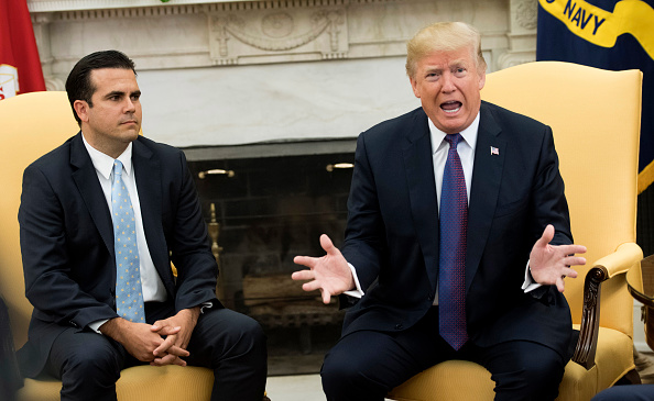 President Donald Trump speaks with Governor Ricardo Rossello of Puerto Rico during a meeting in the Oval Office at the White House on October 19, 2017 in Washington, D.C.