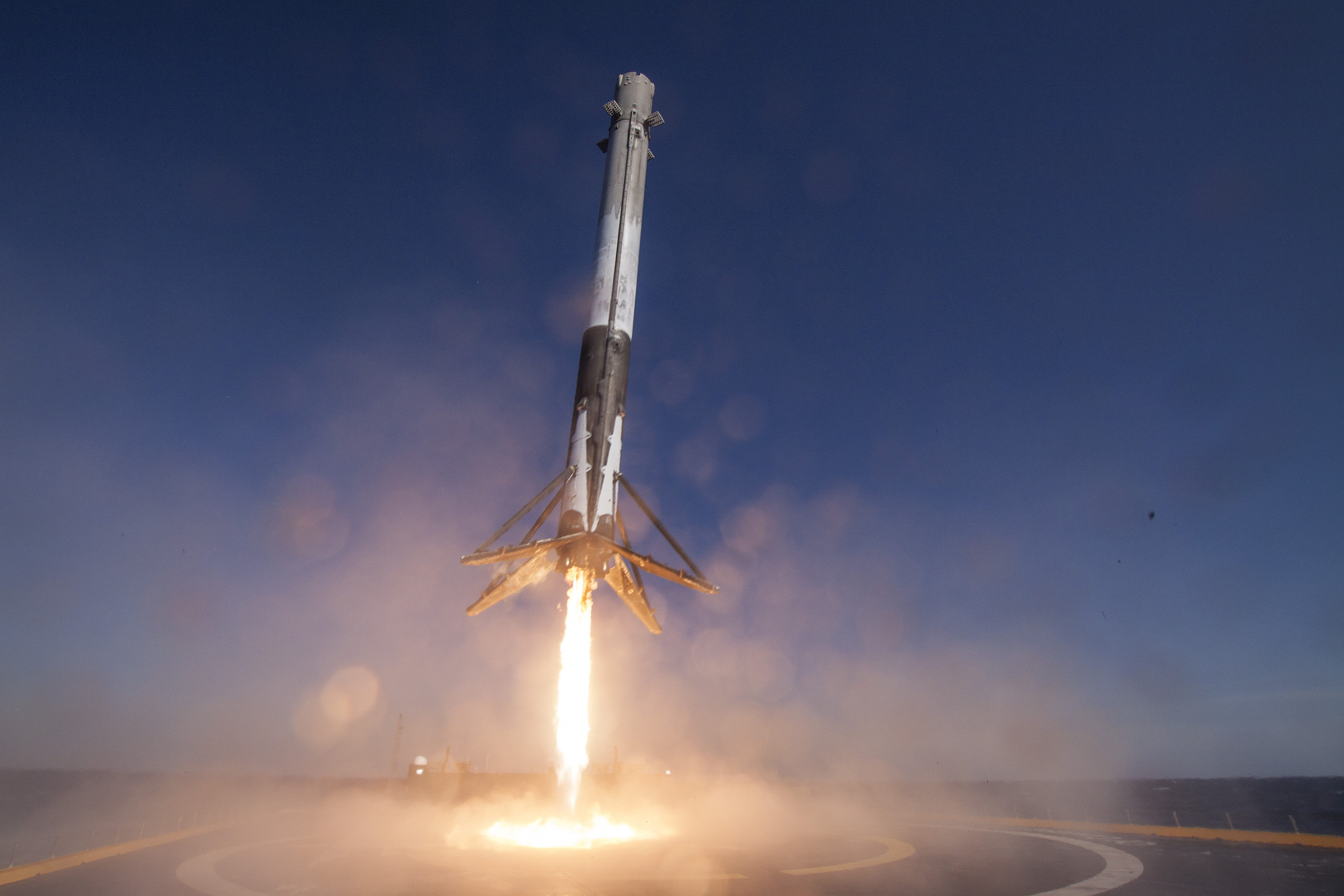 In this handout provided by the National Aeronautics and Space Administration (NASA), SpaceX's Falcon 9 rocket makes its first successful upright landing on the "Of Course I Still Love You" droneship on April 8, 2016 some 200 miles off shore in the Atlan