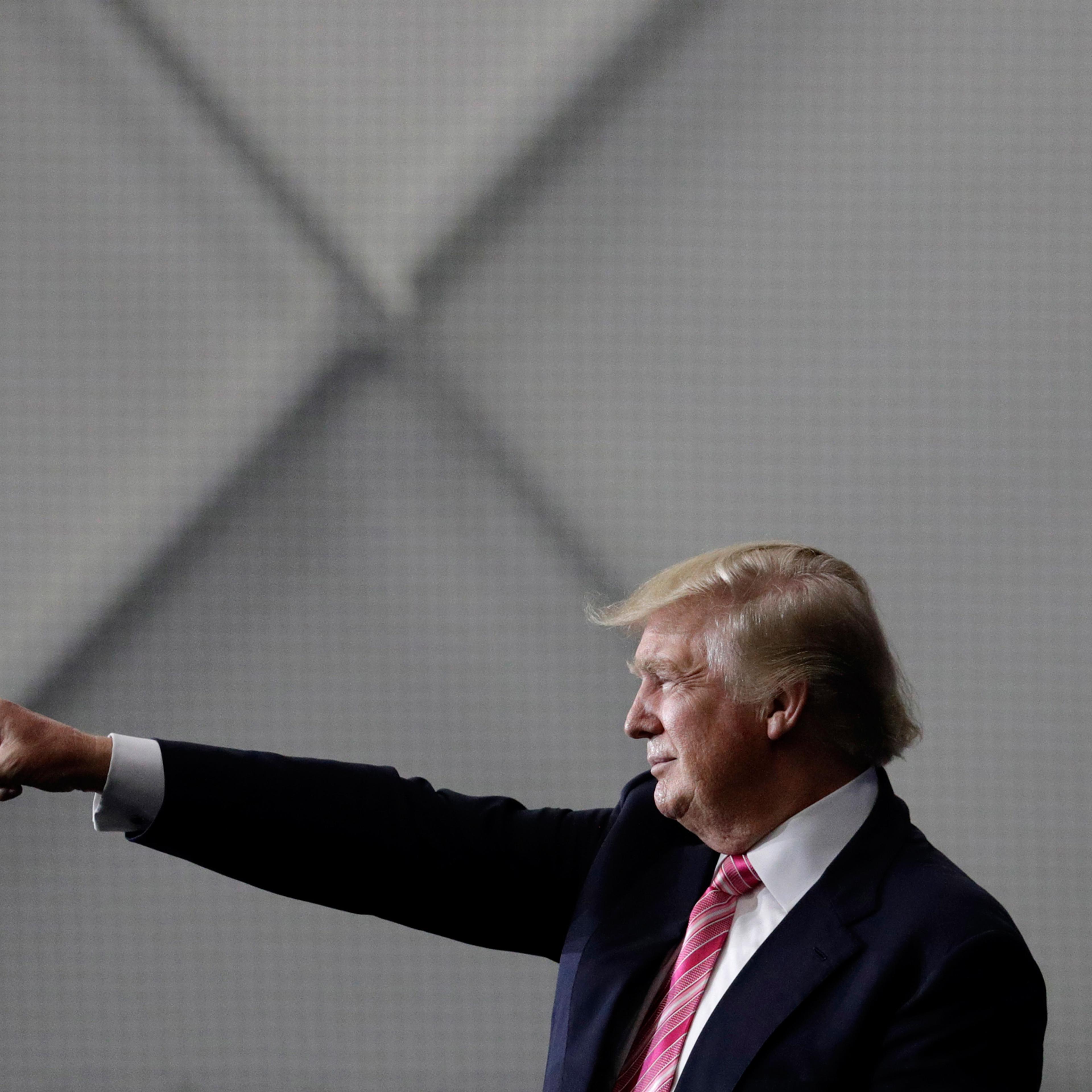 Republican presidential candidate Donald Trump motions to the crowd after speaking at a rally, Saturday, Oct. 1, 2016, in Manheim, Pa. (AP Photo/John Locher)