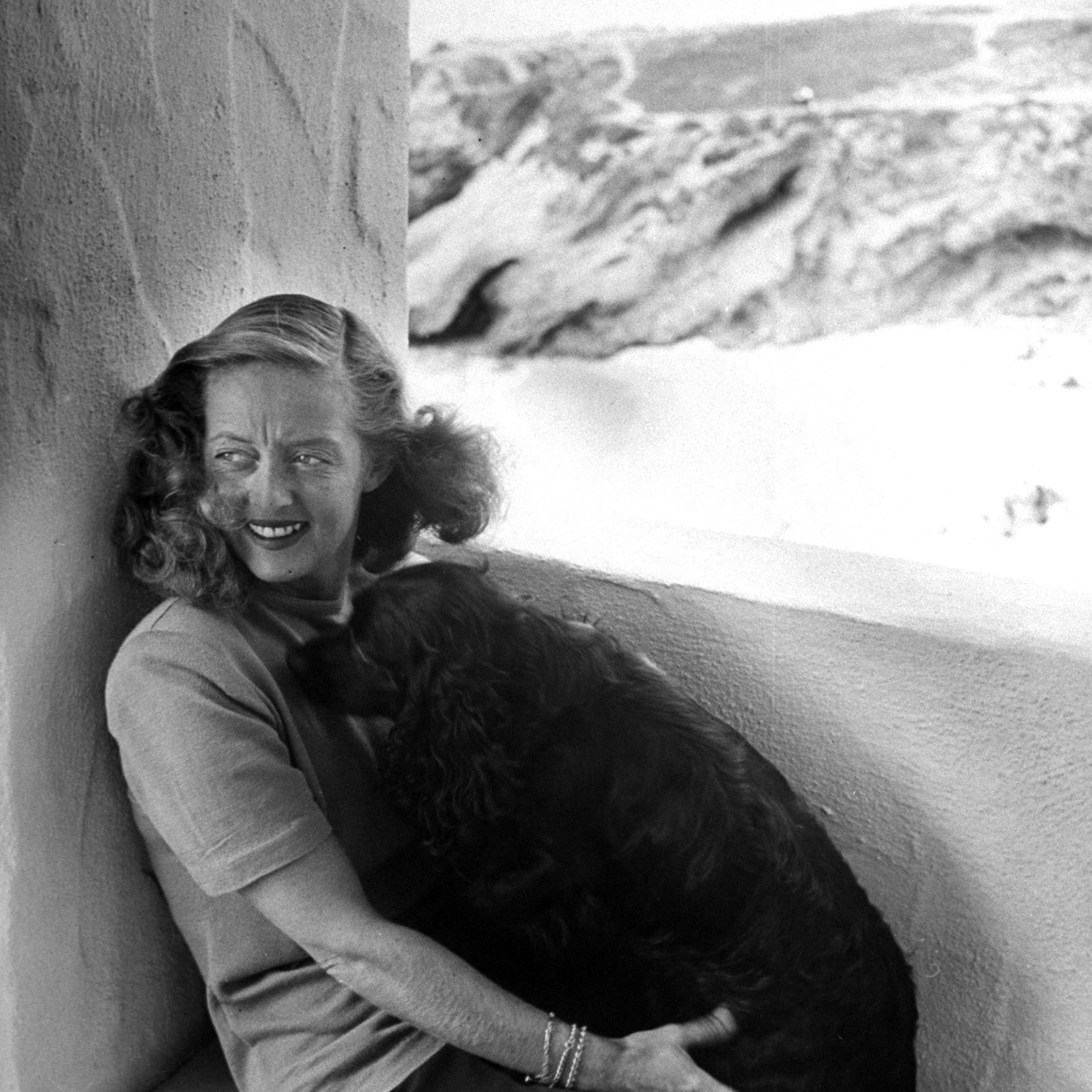 Bette Davis with her dog in California, 1947.