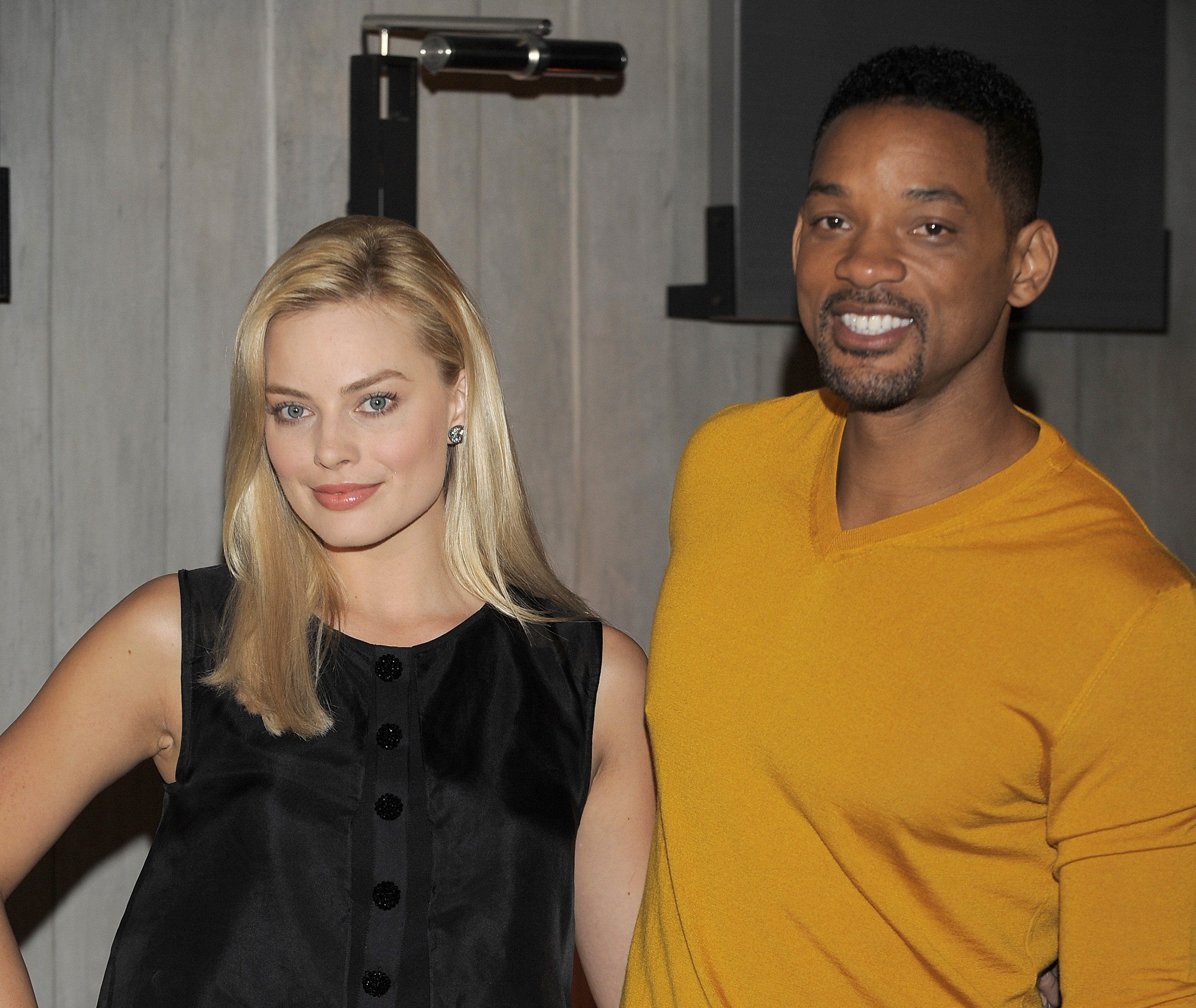 Actors Margot Robbie and Will Smith attend a press conference for 'Focus' in Buenos Aires, Argentina on Nov. 20, 2013.