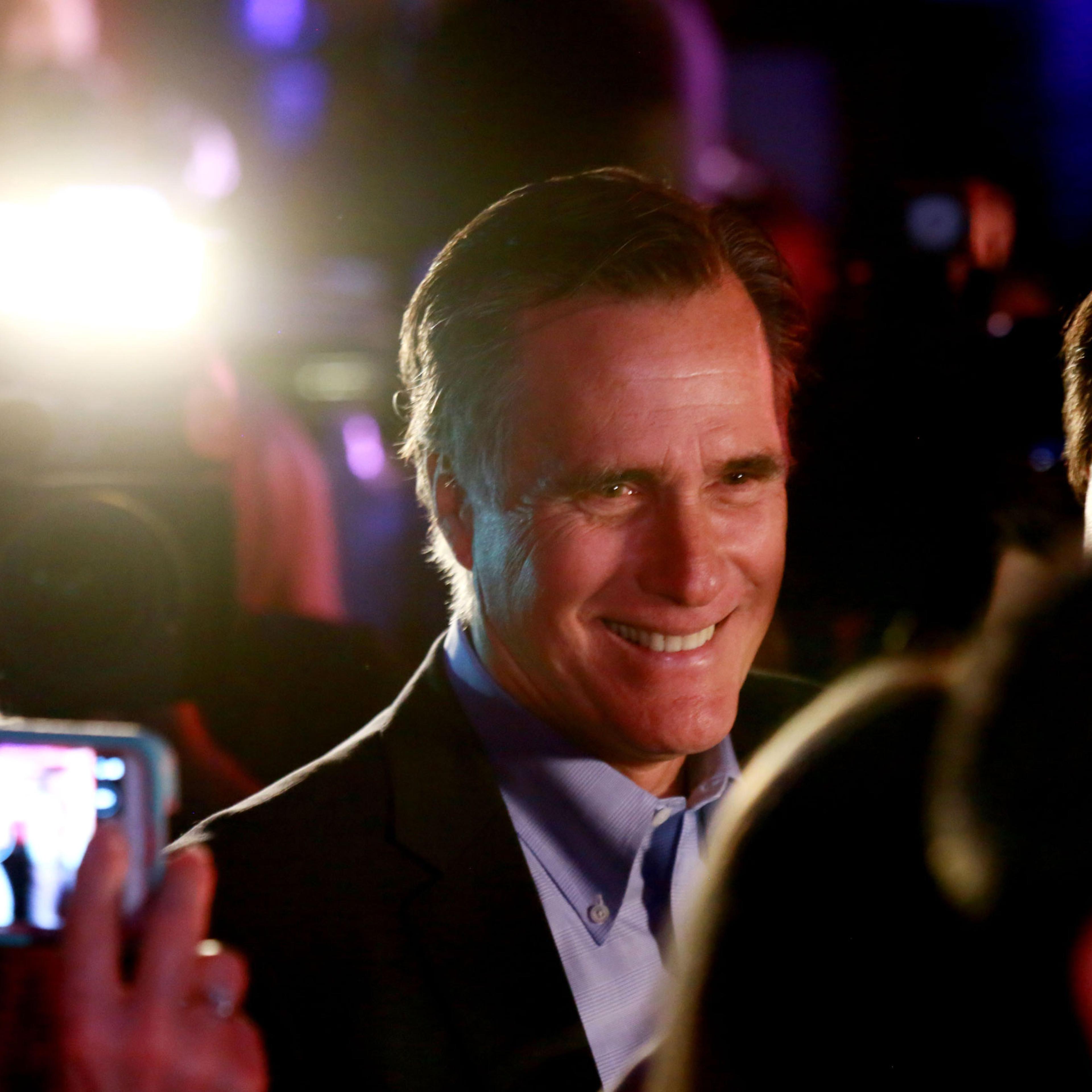 Mitt Romney is greeted by fellow Republicans at a dinner during the Republican National Committee's Annual Winter Meeting aboard the USS Midway on Jan. 16, 2015 in San Diego.