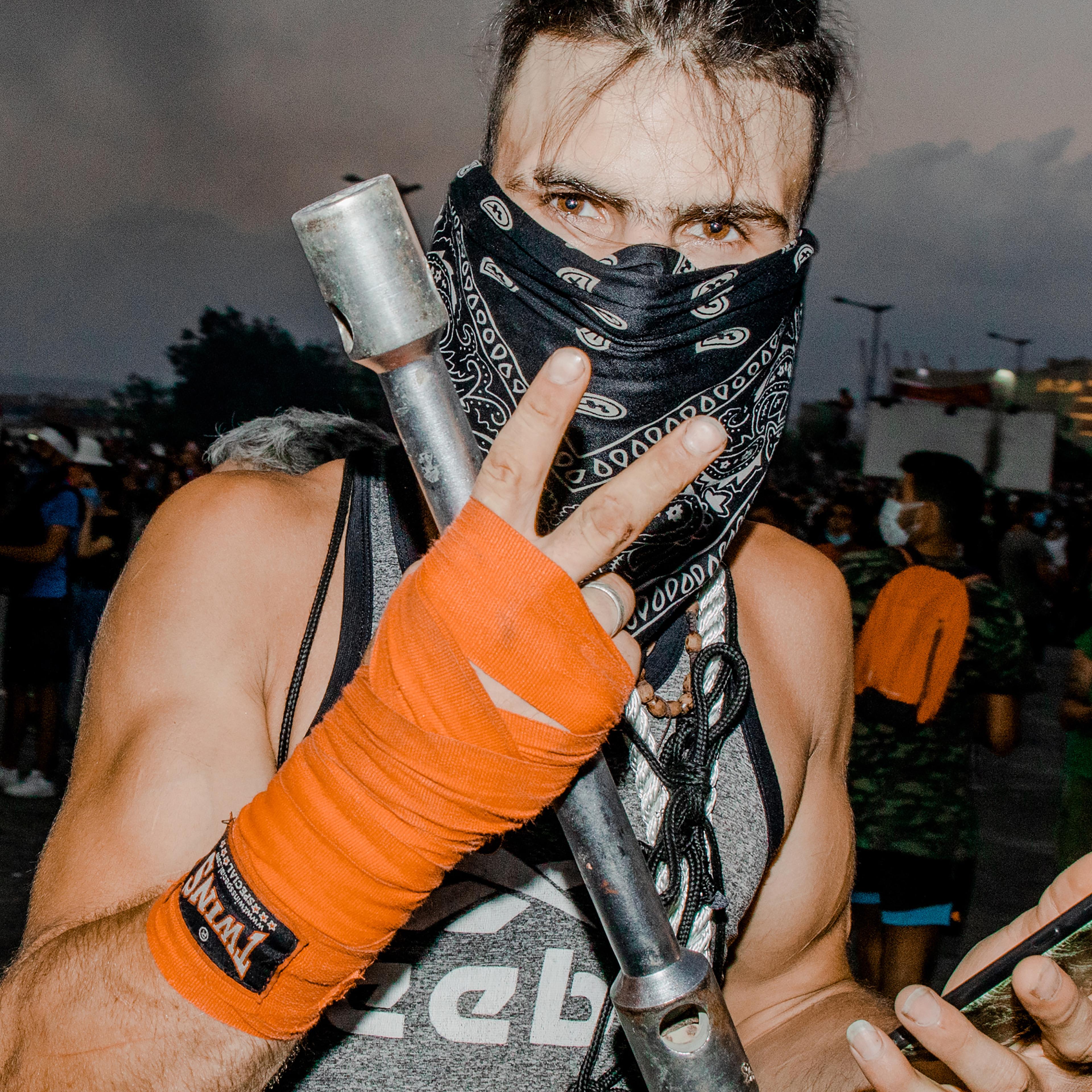 Some protesters on Aug. 8 reportedly threw stones and debris at officers or jumped over barricades that had closed off access to parliament, while others entered government ministries. Officers responded with heavy volleys of tear gas and rubber bullets.