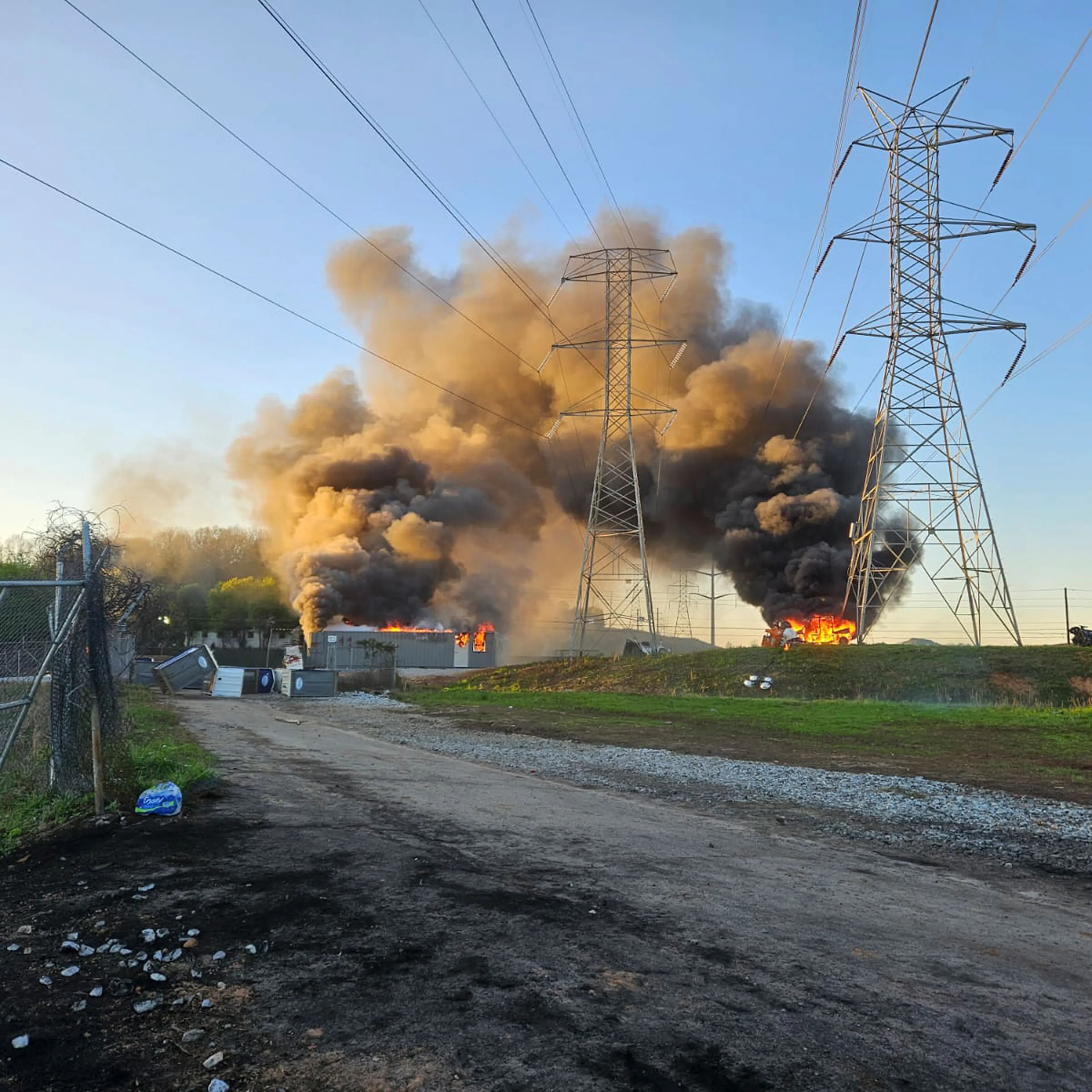 Smoke rises after protesters breached Cop City in Dekalb County, outside Atlanta, on Sunday, Oct. 5, 2023. (Sean Keenan/The New York Times)