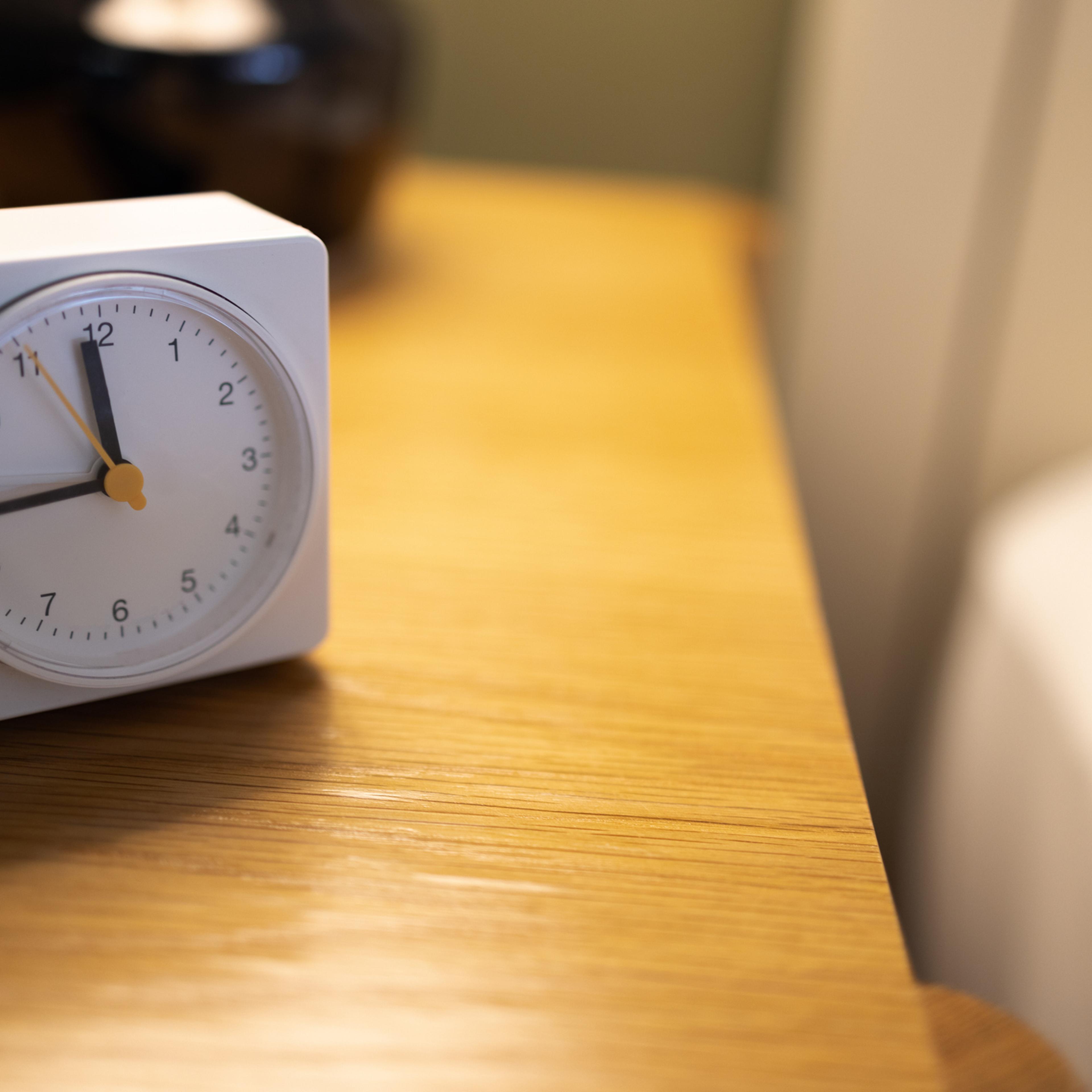 alarm clock on bedside table