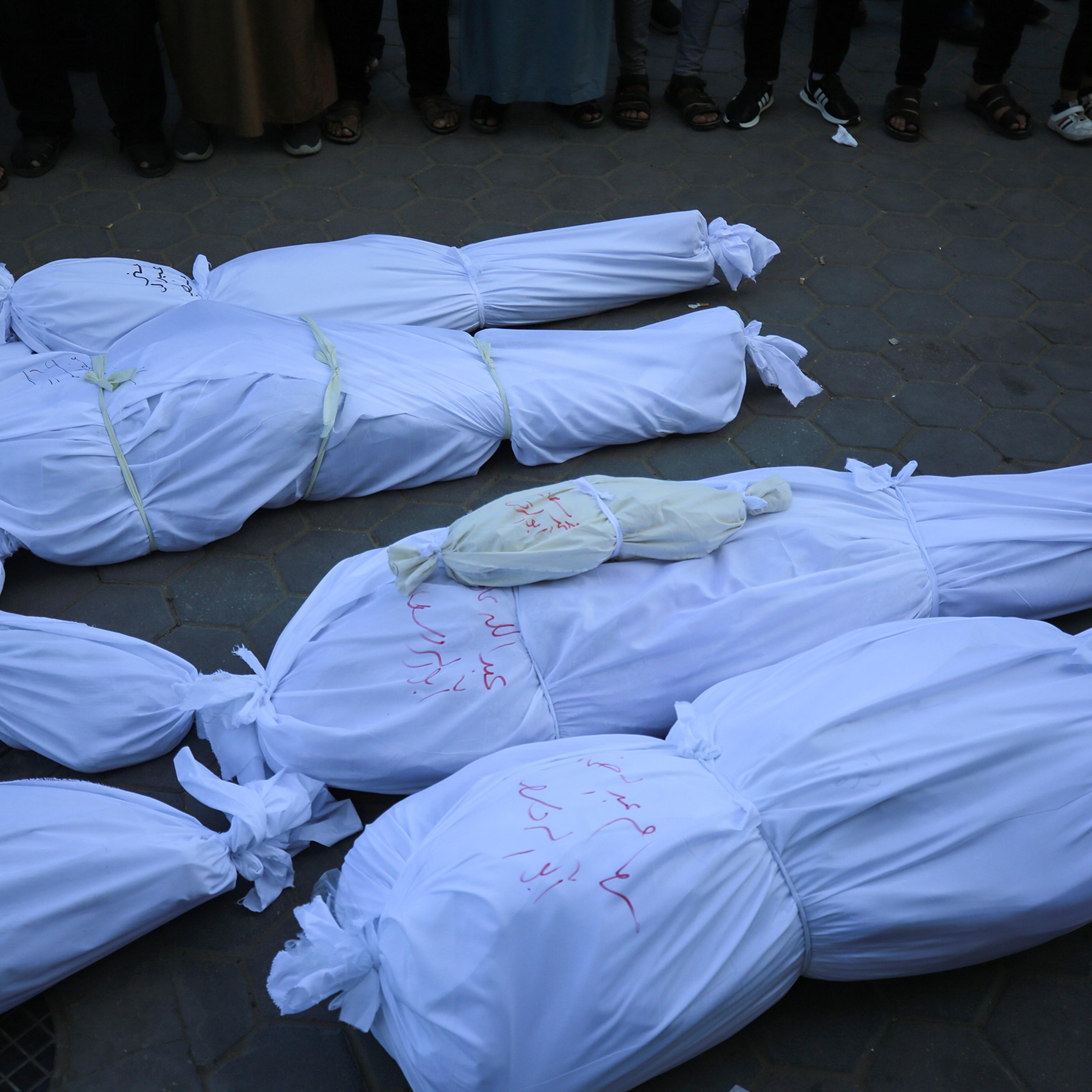 Relatives of Palestinians who lost their lives after Israeli attacks mourn as the bodies are carried for burial outside Al Aqsa Martyrs Hospital in Deir al-Balah in the central Gaza Strip, on Oct. 31.