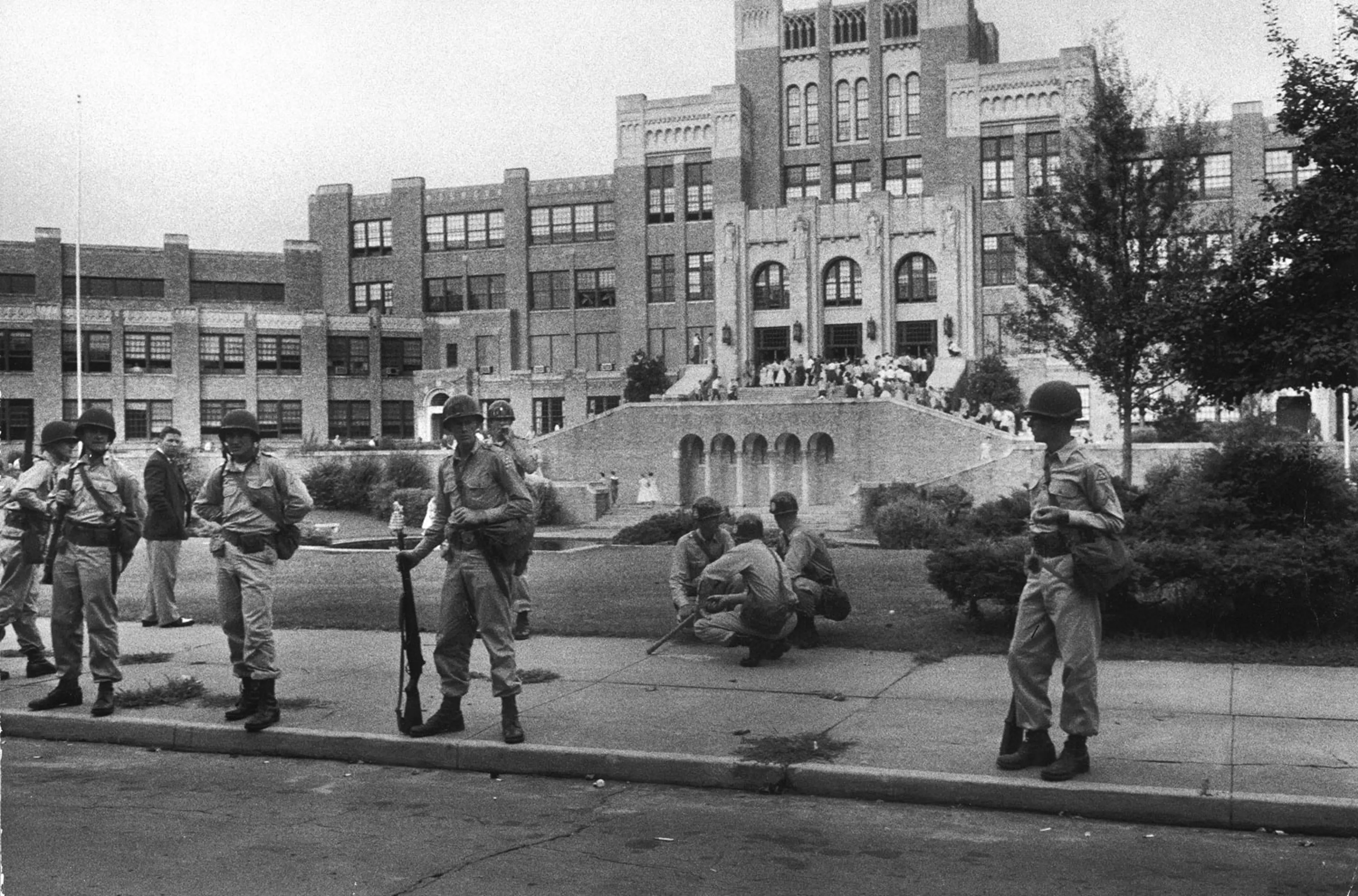 Arkansas National Guard stand on duty during the integration of Little Rock Central High School, 1957.