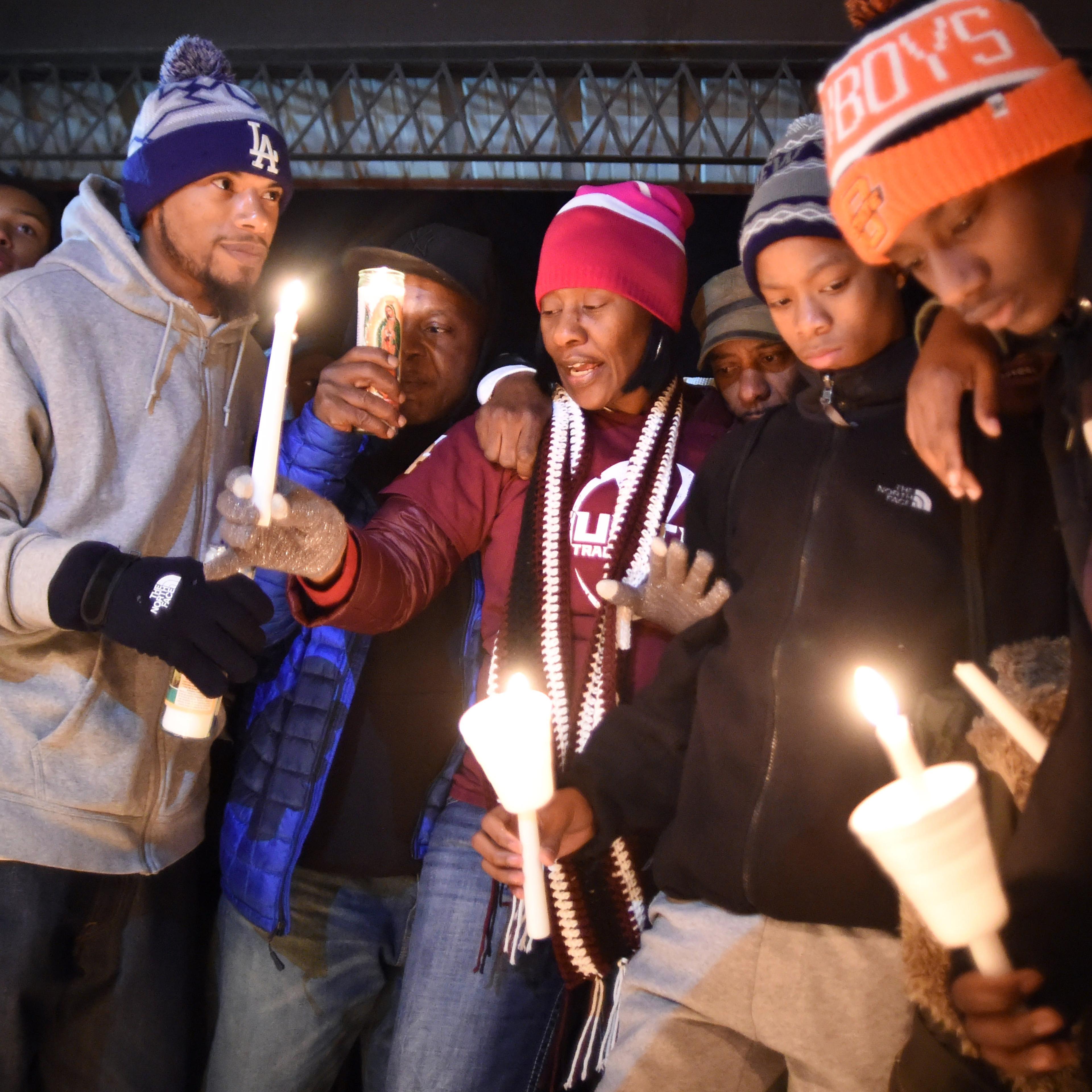 Zenobia Dobson, center, speaks during a candlelight vigil for her slain son, Zaevion Dobson, at Sam E. Hill Park in Knoxville, Tenn., on Dec. 18, 2015.