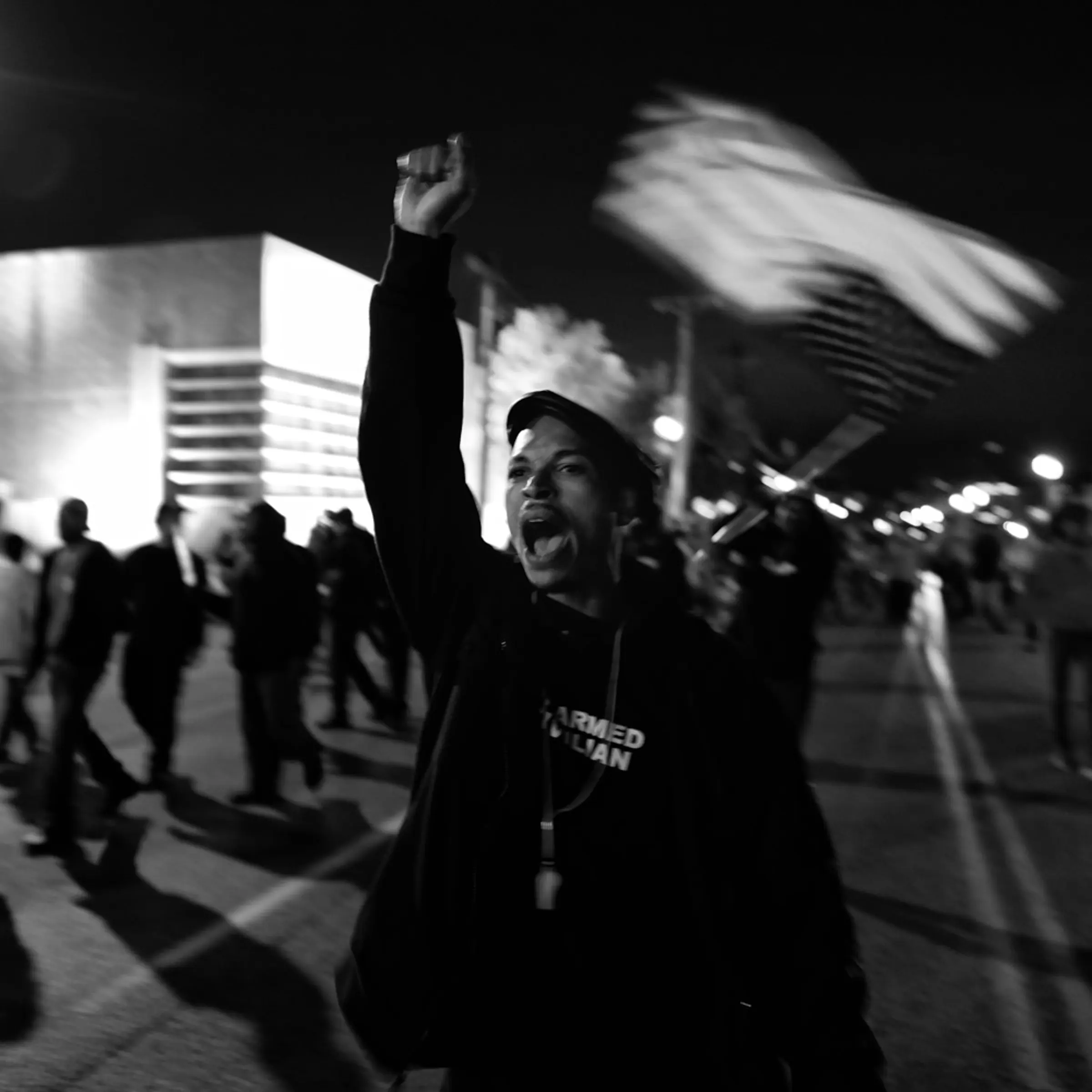 A protester raises his fist during a nightly march toward the Ferguson Police Dept. on Oct. 10, 2014.