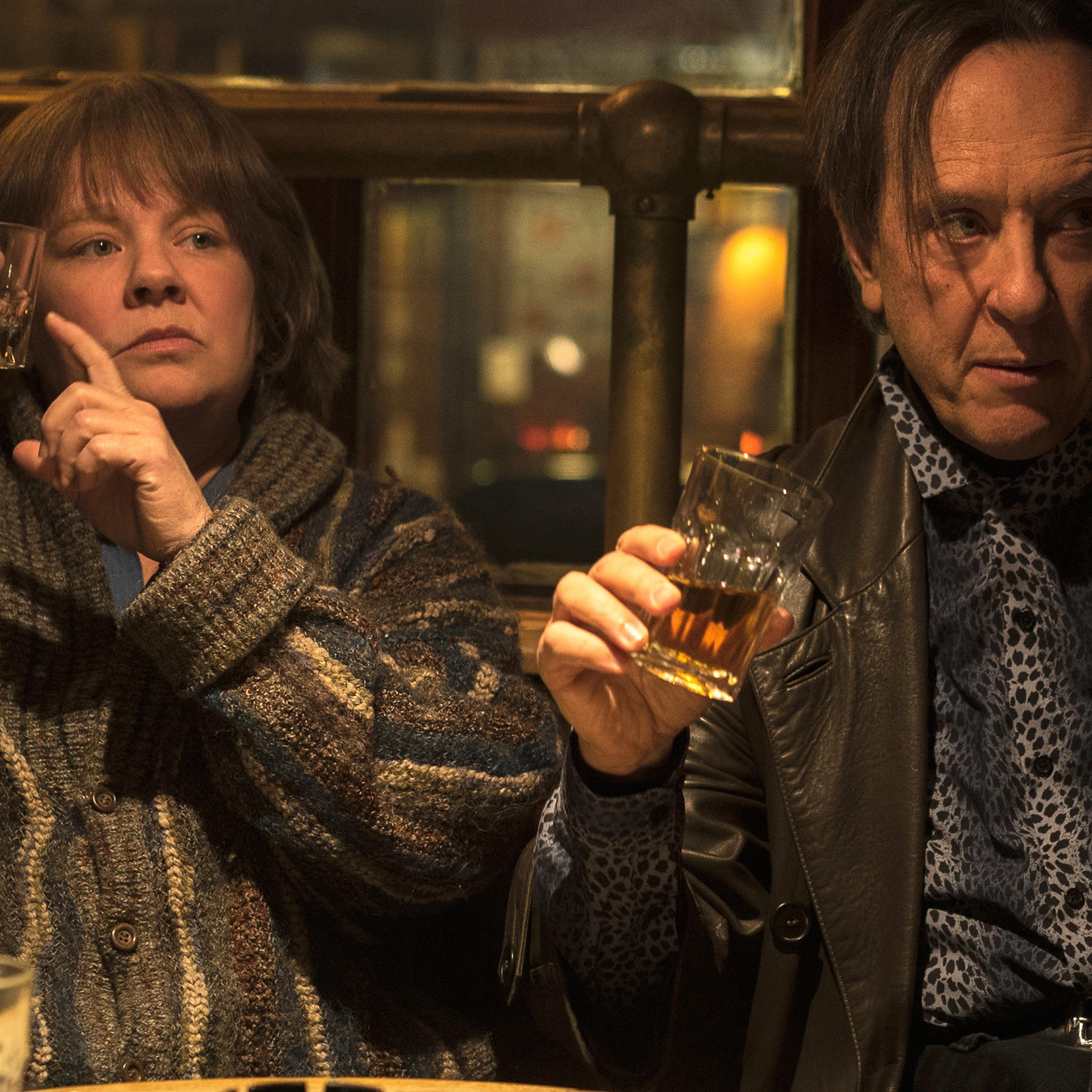 (McCarthy) and Jack (Grant) bond over a stiff drink—or 10