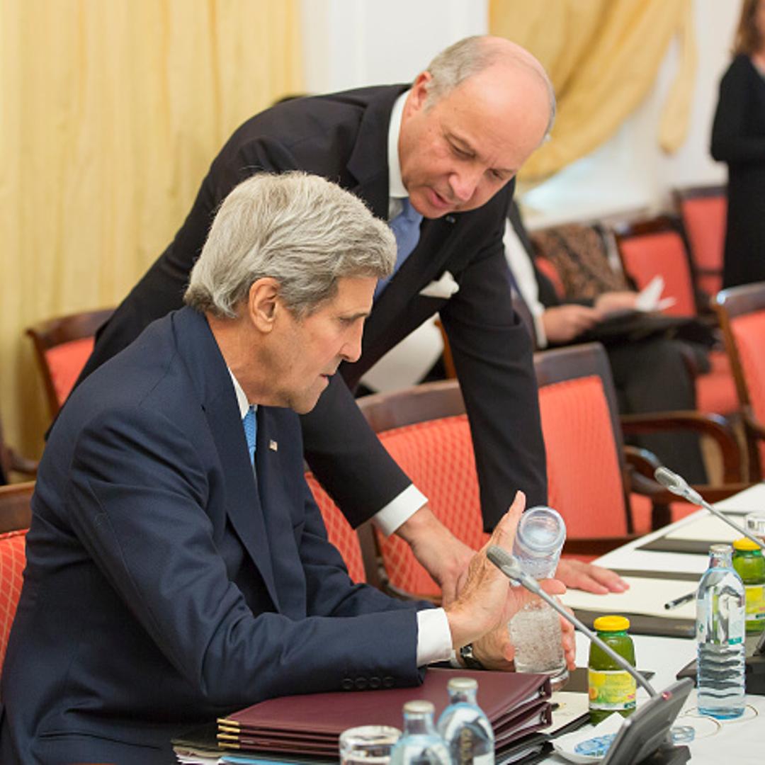 Foreign Minister of France Laurent Fabius (R) talks with U.S. Secretary of State John Kerry during the nuclear talks between the E3+3 (France, Germany, UK, China, Russia, US) and Iran in Vienna, Austria on July 06, 2015.