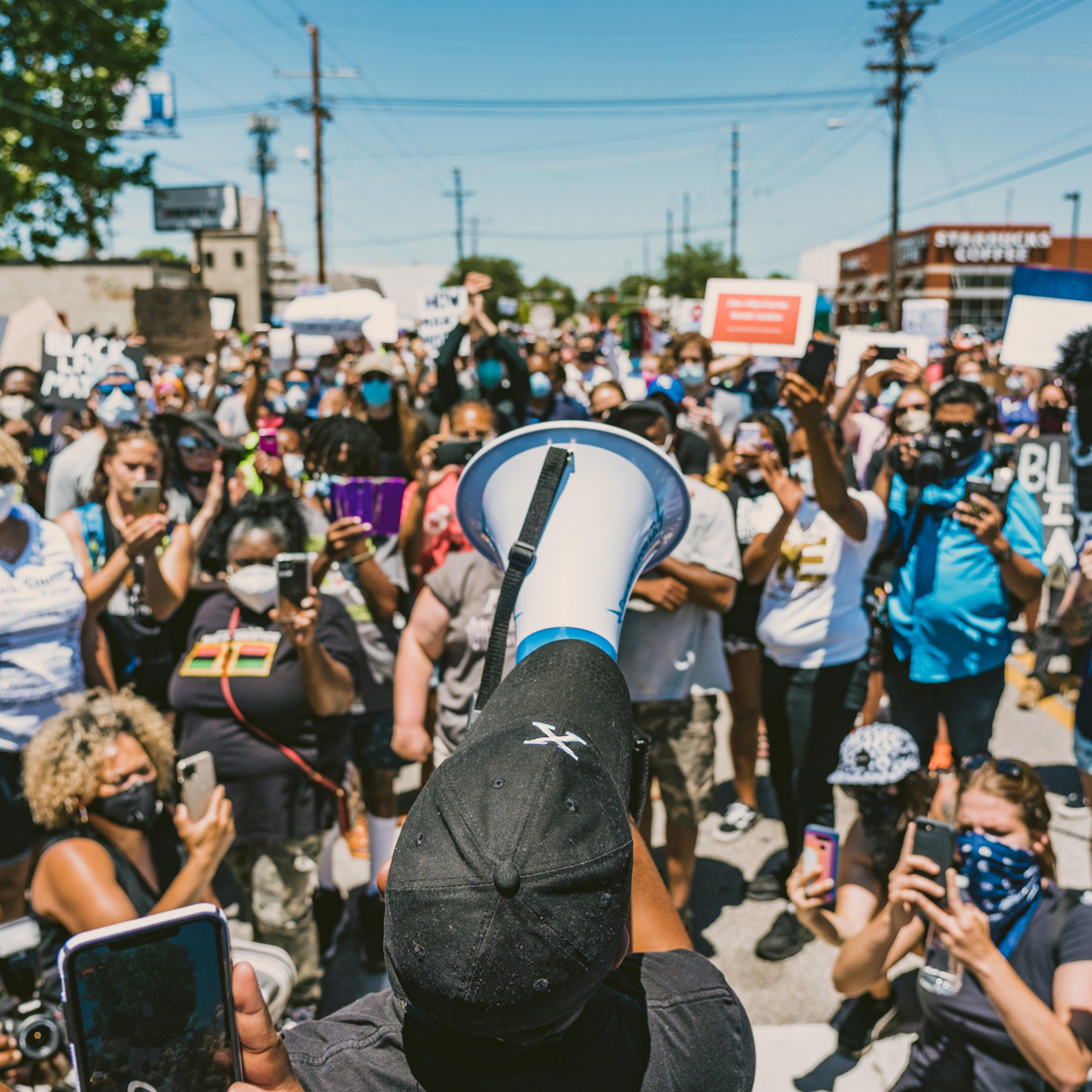 Tulsa activist Greg Robinson leads a protest in downtown Tulsa to protest racial in justice and police brutality in the wake of George Floyd's death.