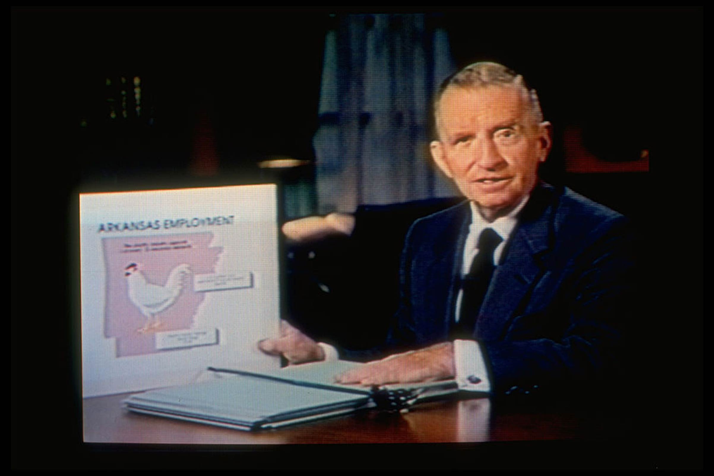 Texas magnate Ross Perot displaying an Arkansas state employment record chart to attack candidate Bill Clinton in a self-financed TV program that aired on Nov. 1, 1992.