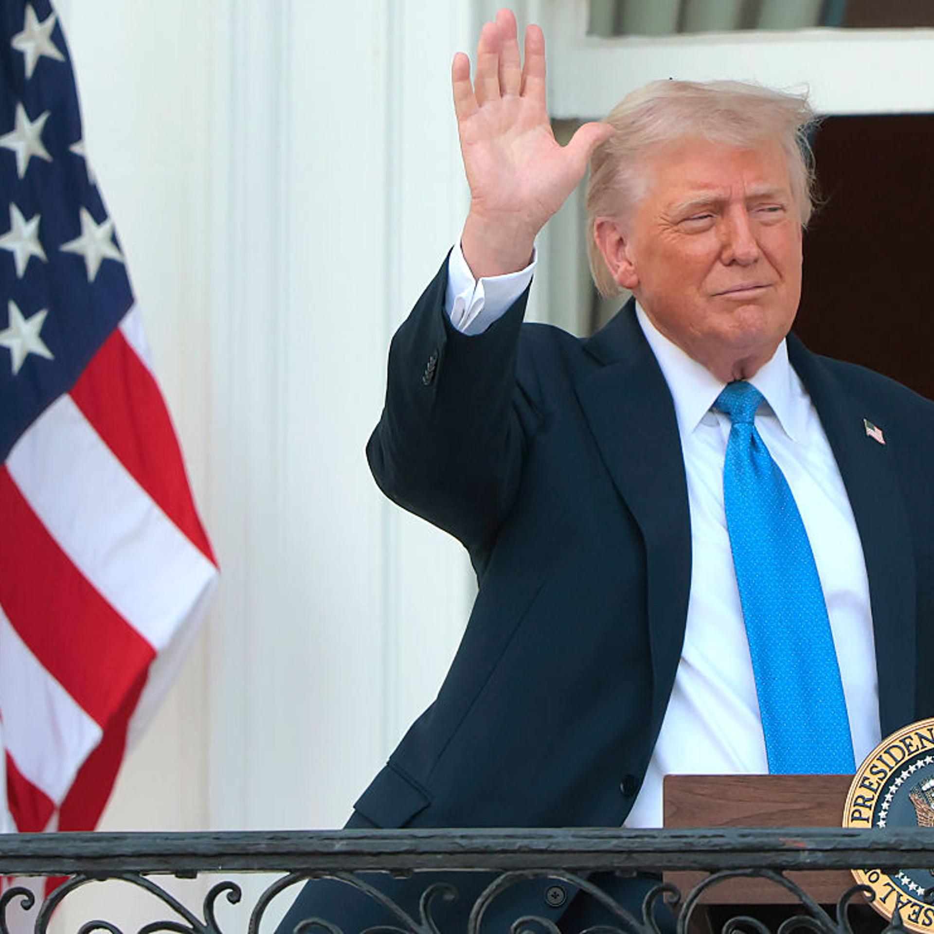 U.S. President Donald Trump waves to guests from South Portico of the White House during an event on the South Lawn in Washington, D.C.. on June 4, 2025.