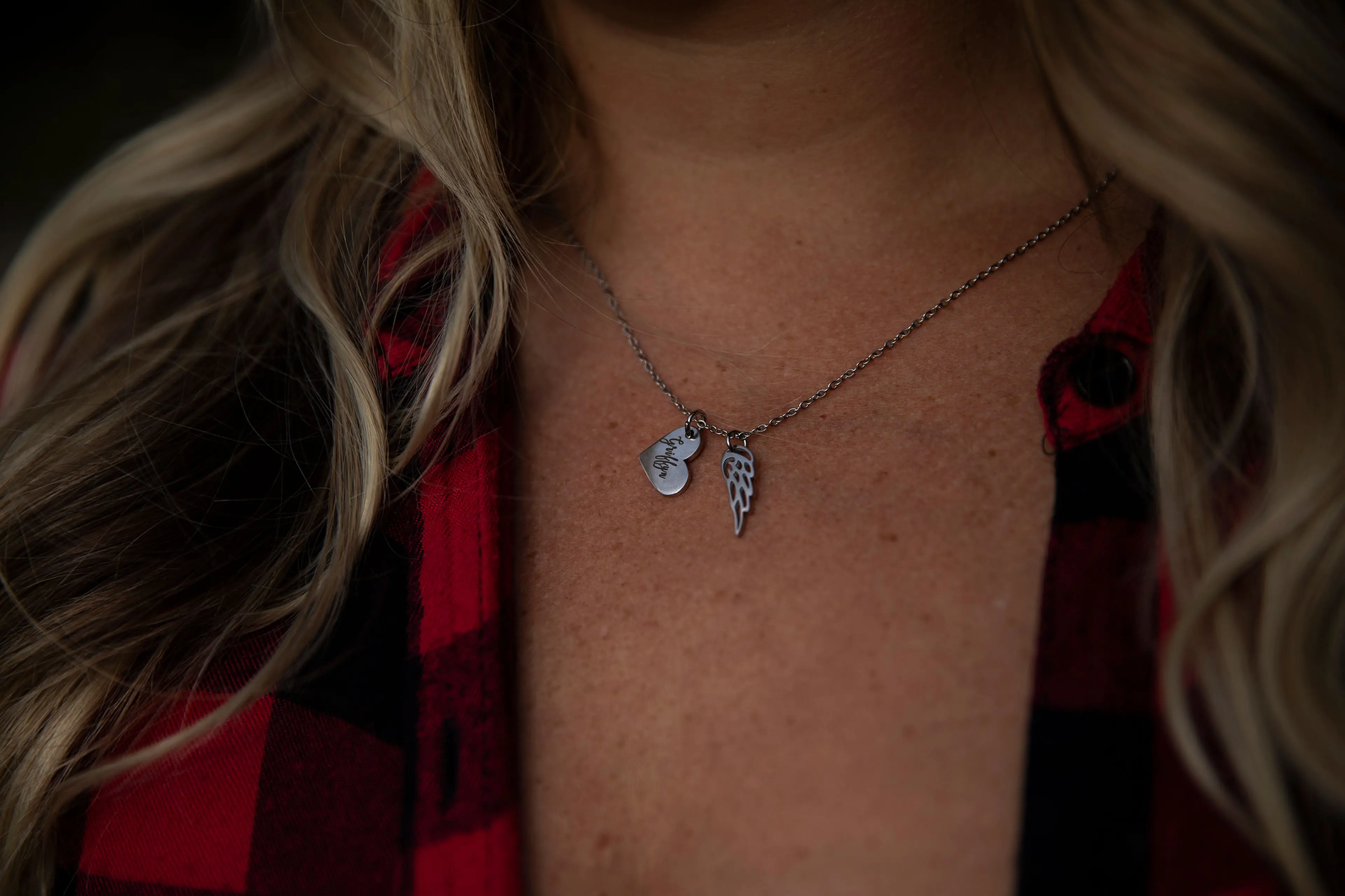 Tara George wears a necklace in honor of her son in Berea, OH on August 22, 2022. Tara had a wanted pregnancy and found out at 20 weeks that the fetus had multiple lethal anomalies, which would also have put her own life in danger even if she tried to de